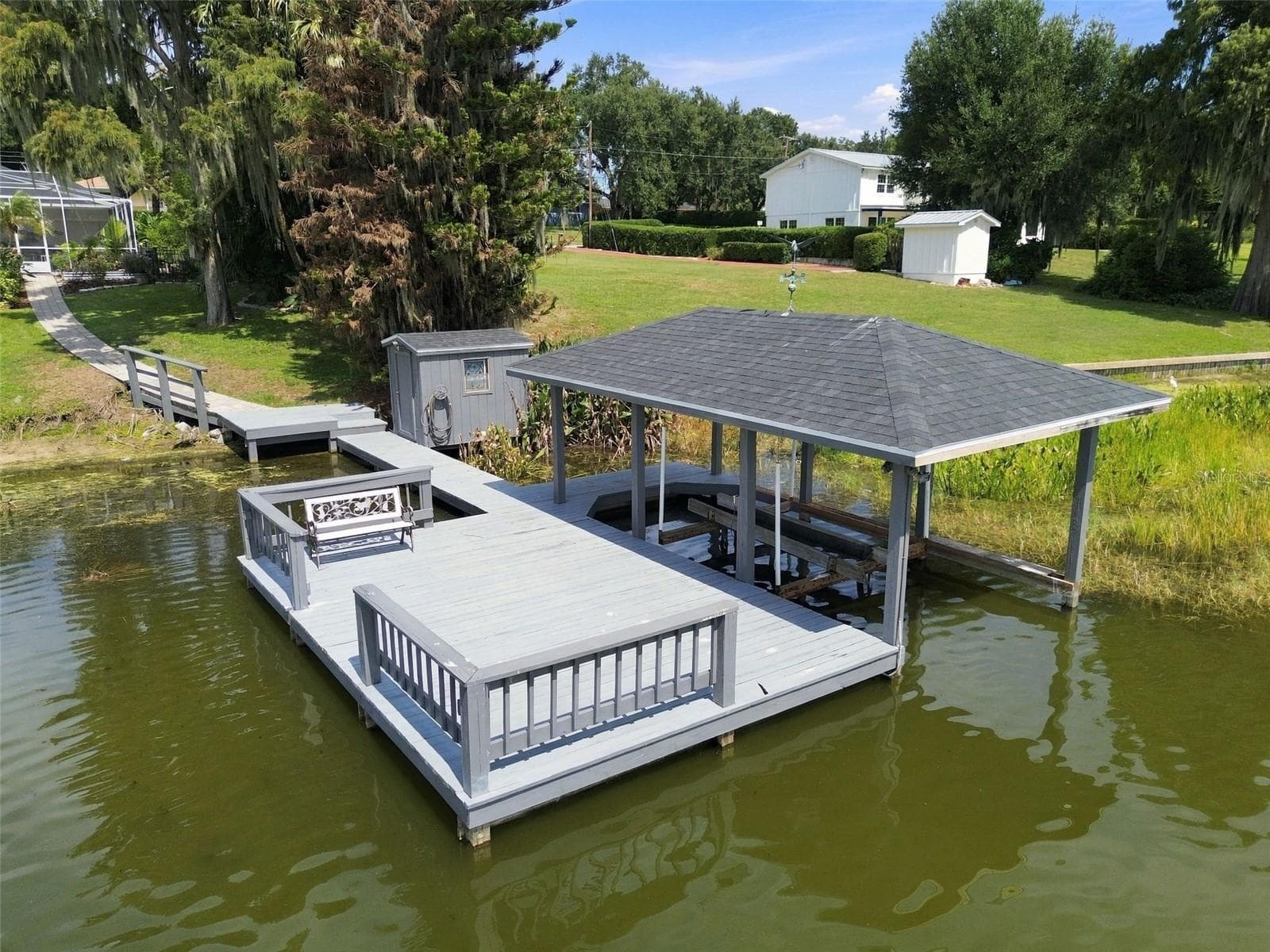 Dock & boathouse with lift - 1921 MANOR CIR SE, WINTER HAVEN