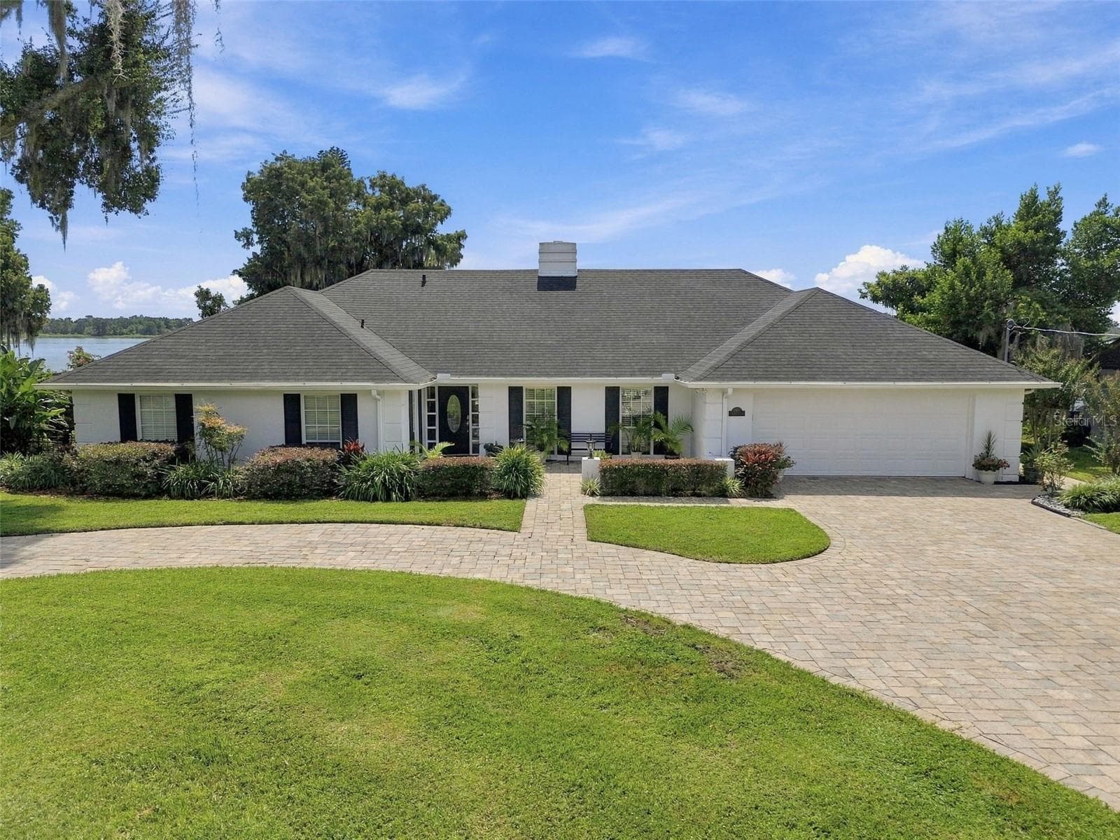 Front exterior - circle brick paved drive, walkways & courtyard - 1921 MANOR CIR SE, WINTER HAVEN