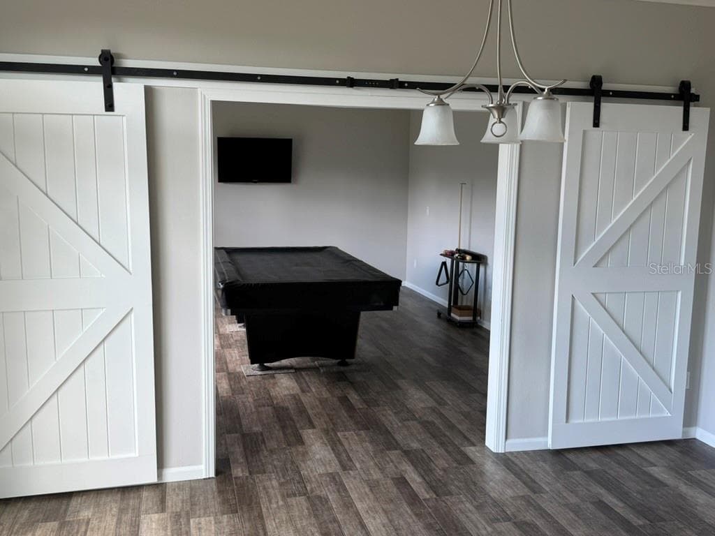 Barn doors to game room - 19930 E FIFTH ST, UMATILLA