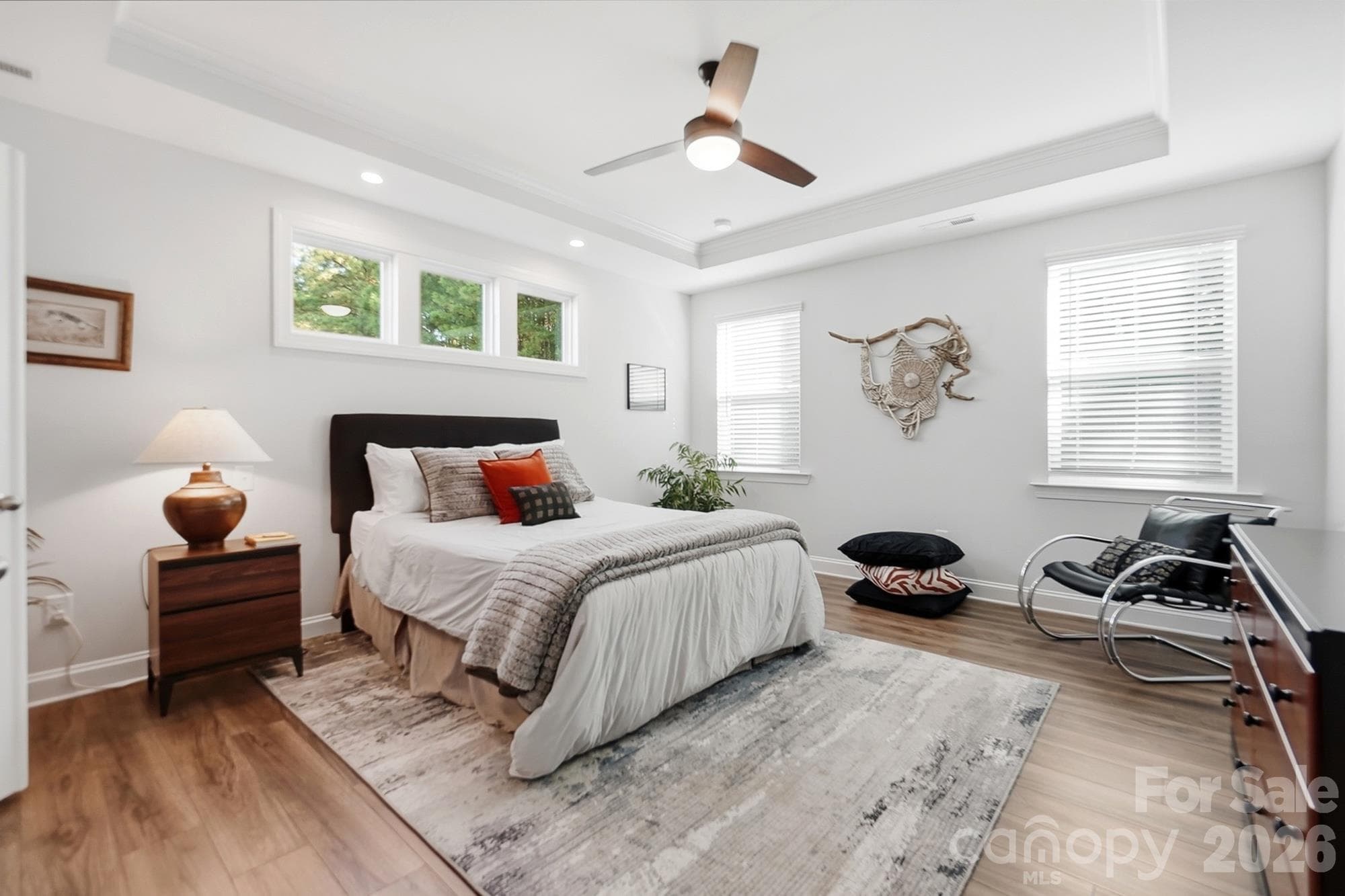 Primary bedroom with 3 transom windows and additional recessed lighting - 2014 Old Evergreen Parkway, Indian Trail