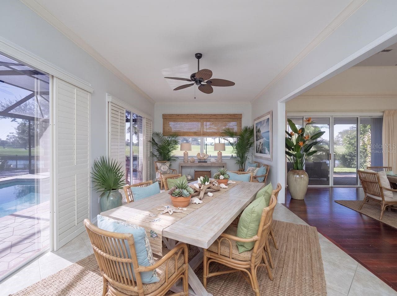 family room virtually staged as a dining area - 71 CAYMAN ISLES BLVD, ENGLEWOOD