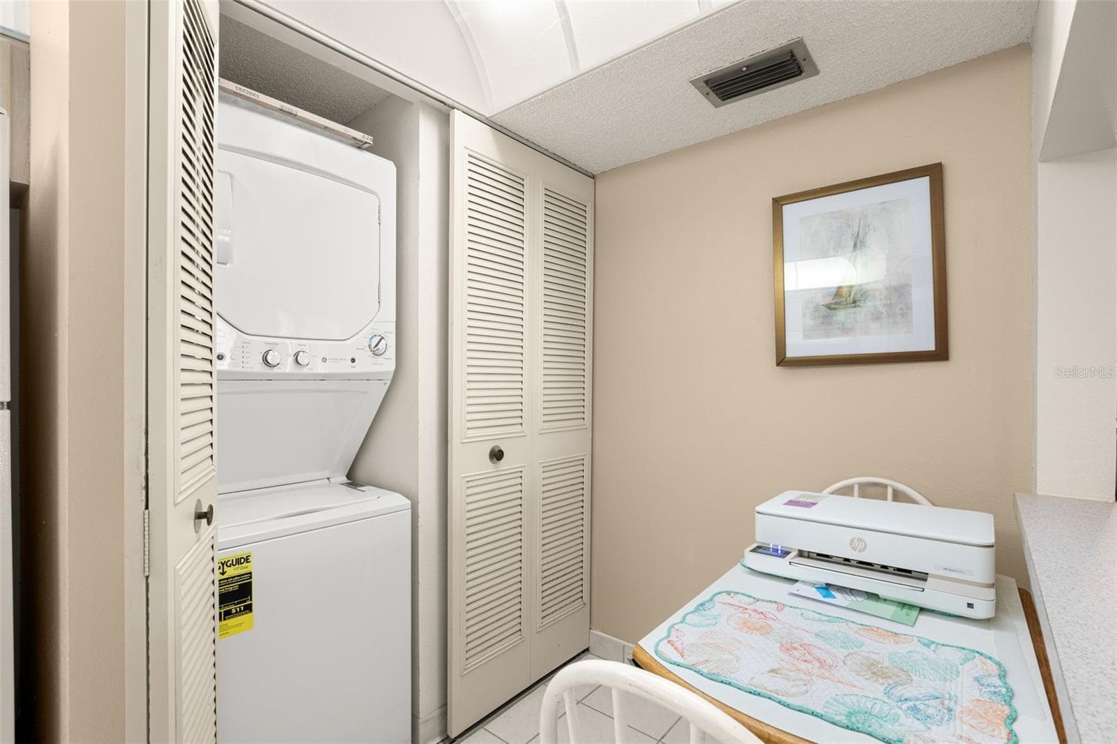 Washer/dryer in kitchen - 1708 PINE RIDGE WAY E #B2, PALM HARBOR