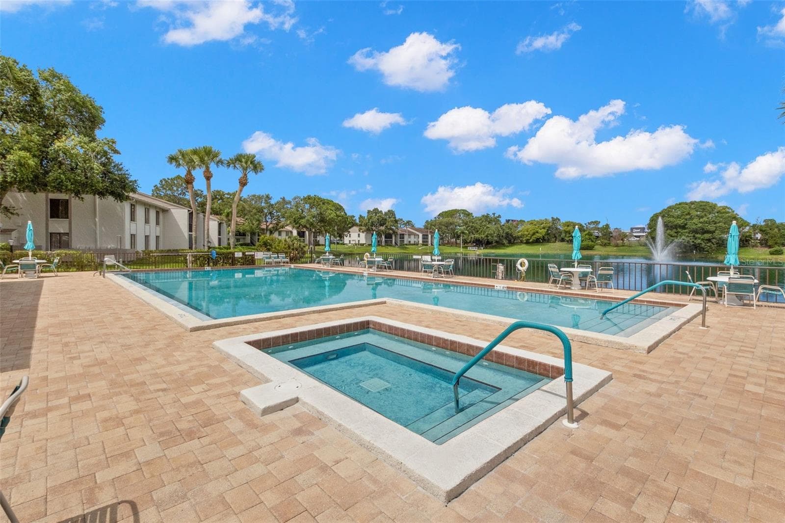 Heated pool outside of clubhouse - 1708 PINE RIDGE WAY E #B2, PALM HARBOR