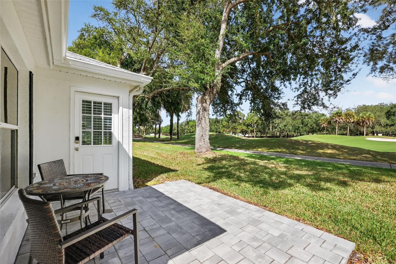 Rear Paver Patio Overlooking Golf Course - 1201 BARCELONA DR, THE VILLAGES
