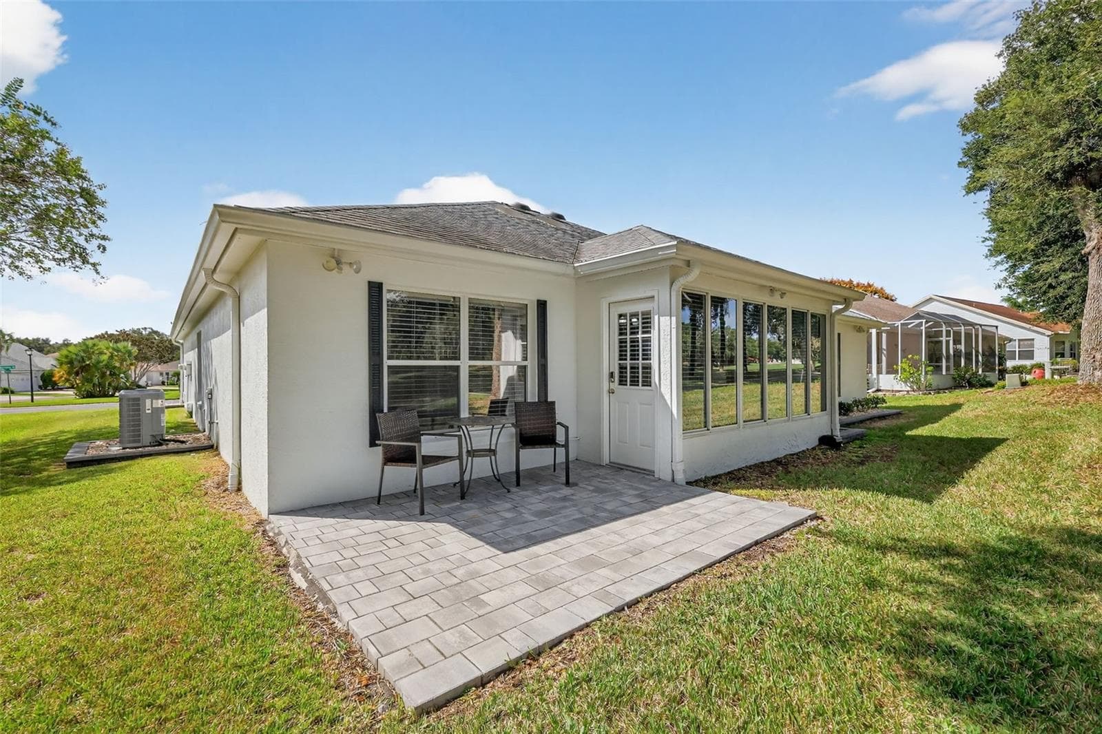 Rear Paver Patio Overlooking Golf Course - 1201 BARCELONA DR, THE VILLAGES