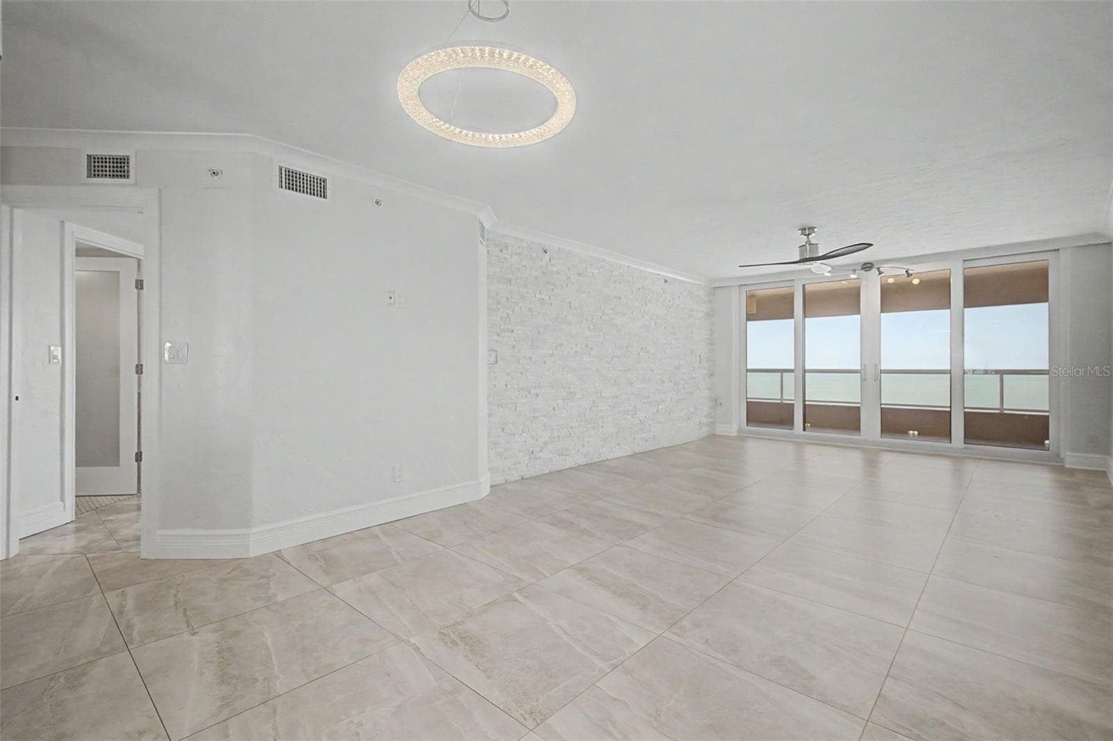 Large Living / Great room with Sliders leading to the Gulf front Balcony - 1310 GULF BLVD #14E, CLEARWATER