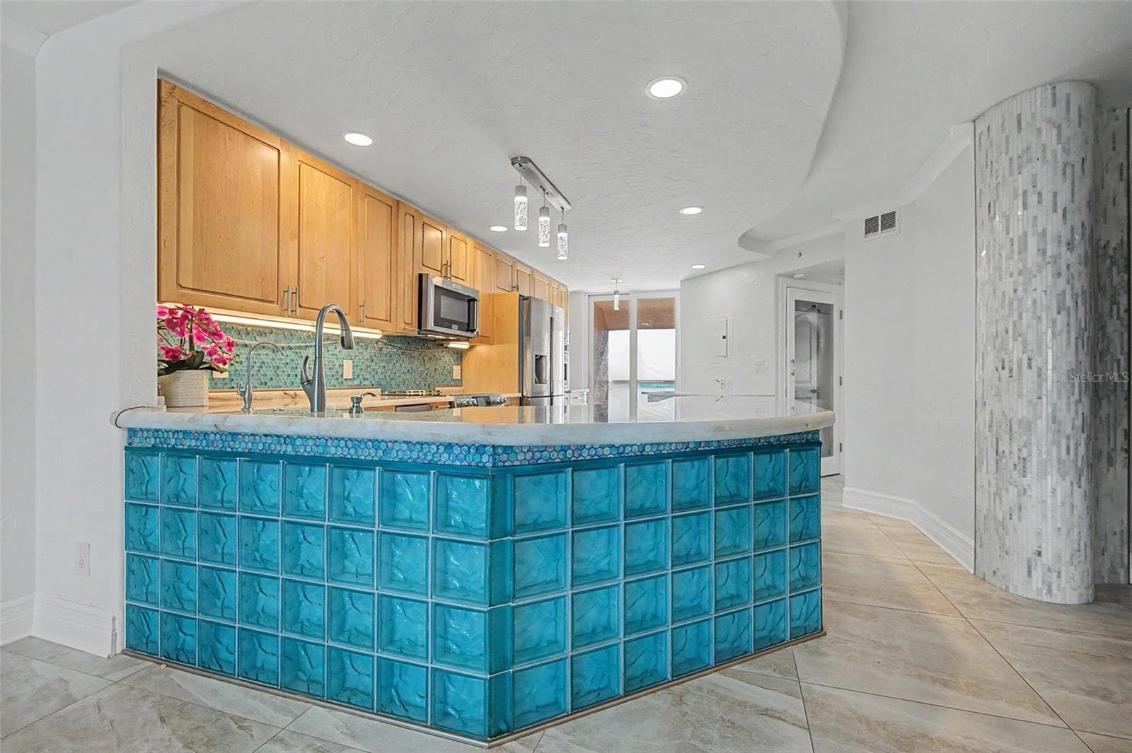 The Contemporary Kitchen with glassed breakfast bar! - 1310 GULF BLVD #14E, CLEARWATER