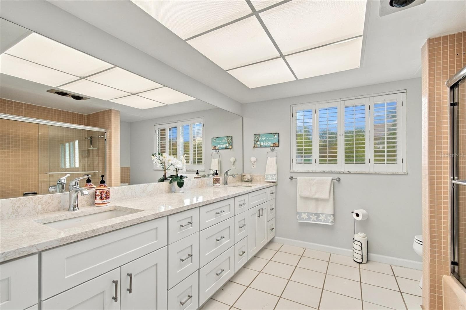 Guest Bath with Double Vanities - 11975 7TH ST E, TREASURE ISLAND