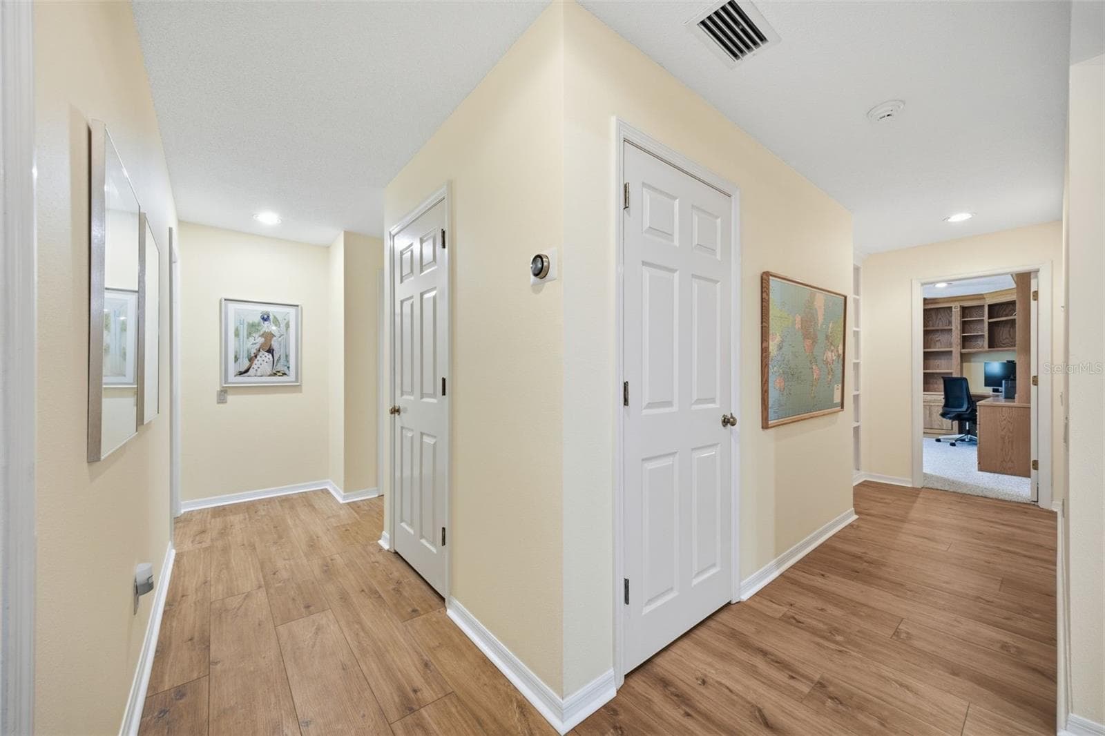 Second Floor hallway to bedrooms and linen closet. - 12383 WINDTREE BLVD, SEMINOLE