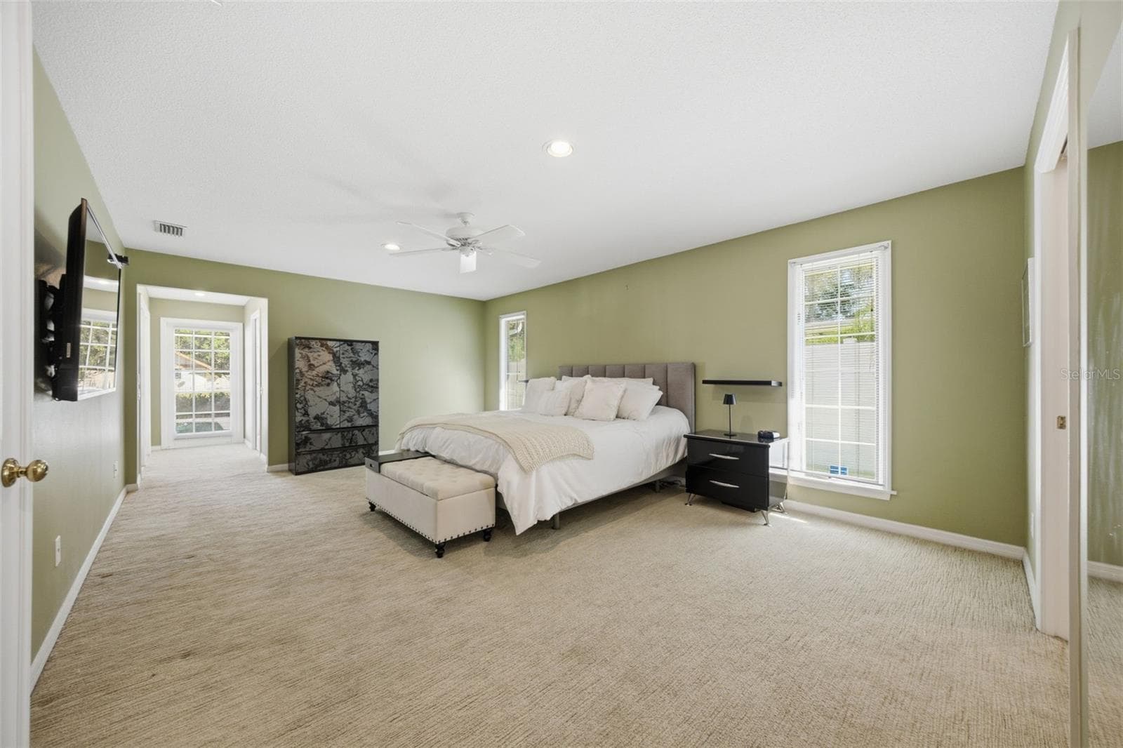 First Floor - Primary Suite offers two walk-in closets and access to Lanai - 12383 WINDTREE BLVD, SEMINOLE