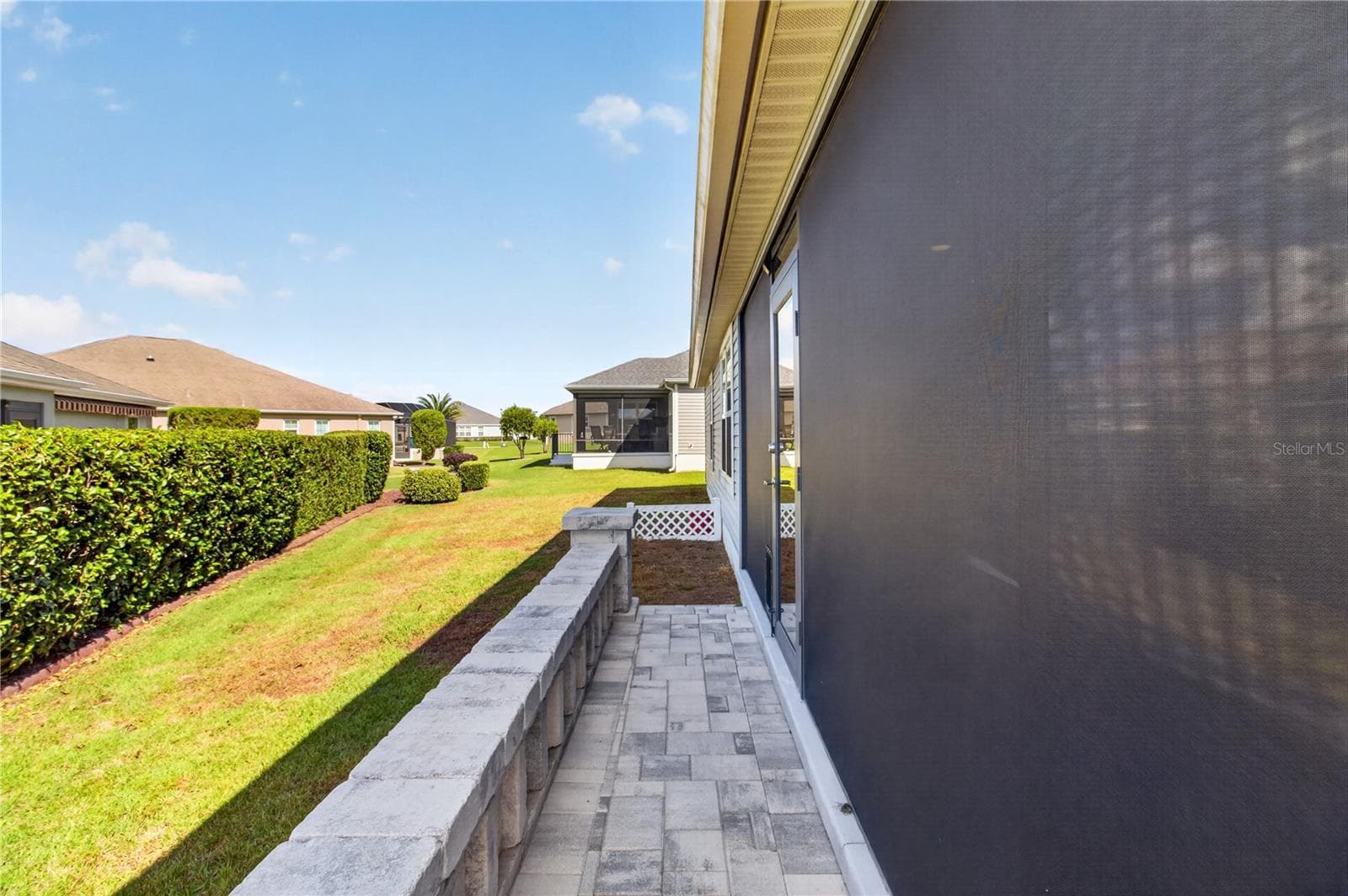 Side walkway to the lanai - 3342 VELTRE WAY, THE VILLAGES