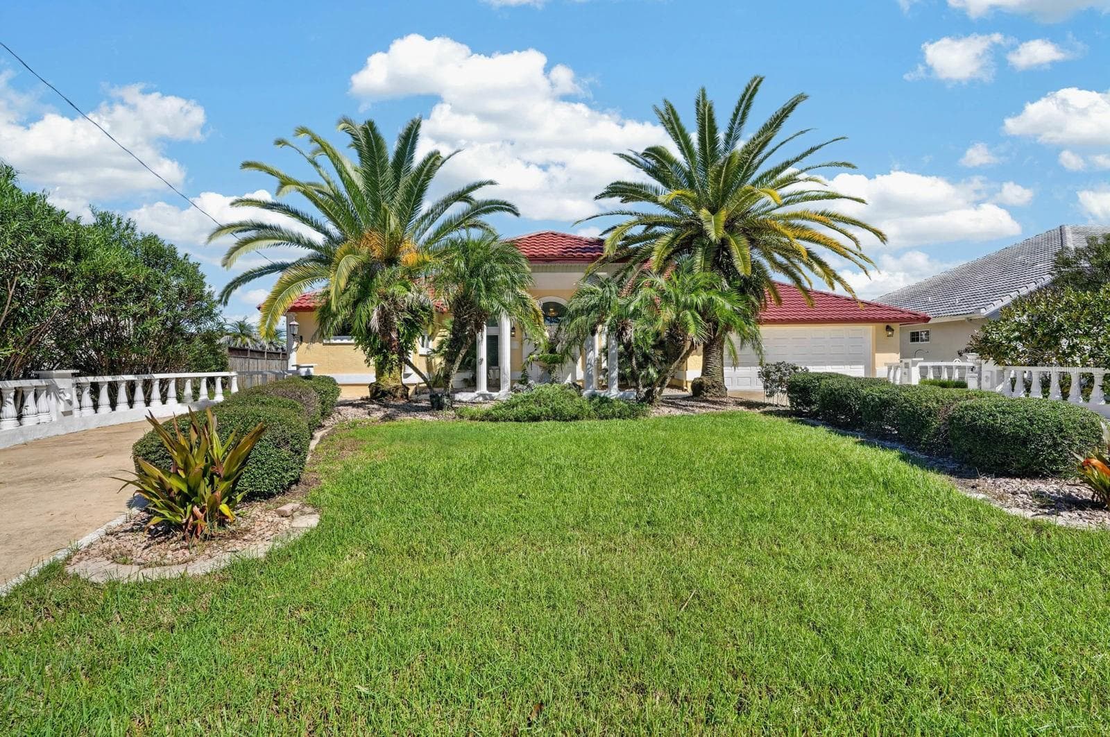 Welcoming Entrance with Tropical Landscaping - 74 COVINGTON LN, PALM COAST