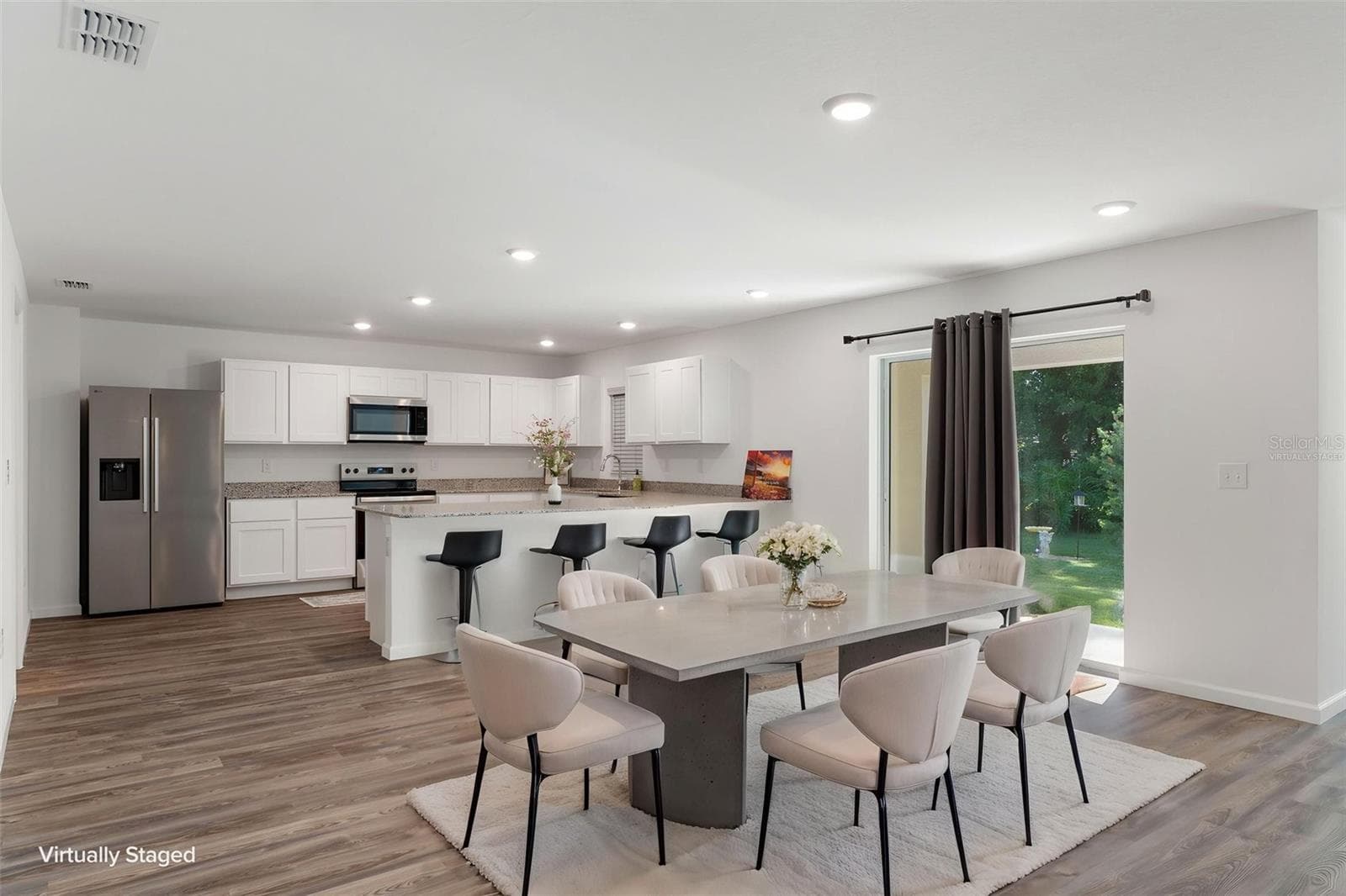 VIrtually Staged Dining Room and Kitchen - 35040 SMOKETREE LN, DADE CITY