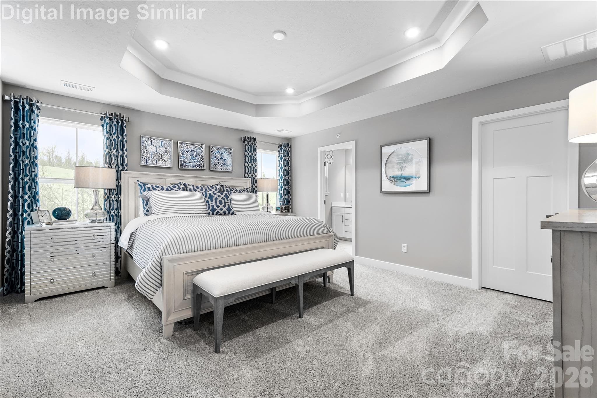 Elegant ensuite retreat featuring two spacious closets and a private bath with refined finishes. Designed for comfort and privacy, this serene space blends luxury with everyday ease. - 11204 Emerson Landing Drive, Charlotte