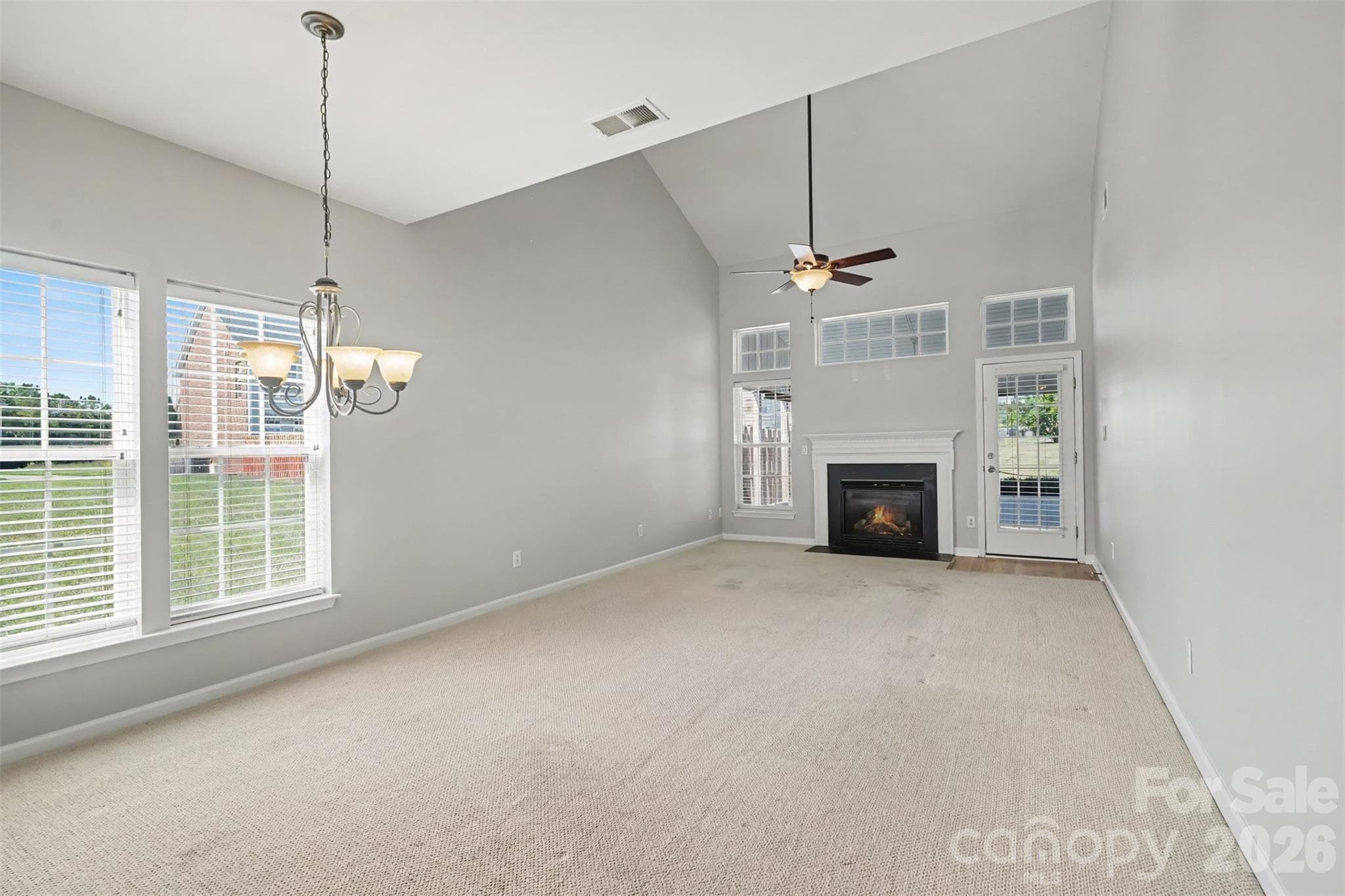 Dining room flows seamlessly into the living room with fireplace - 4083 Holly Villa Circle, Indian Trail