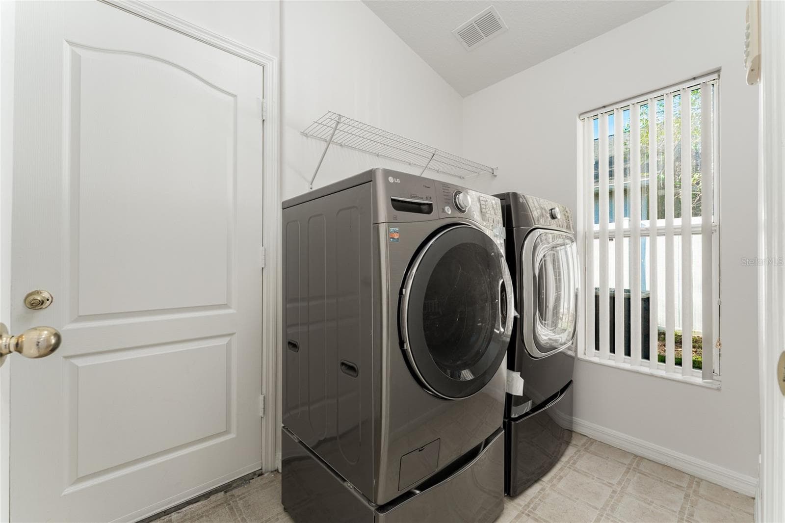 large laundry room - 1127 ROLLING STONE RUN, ODESSA