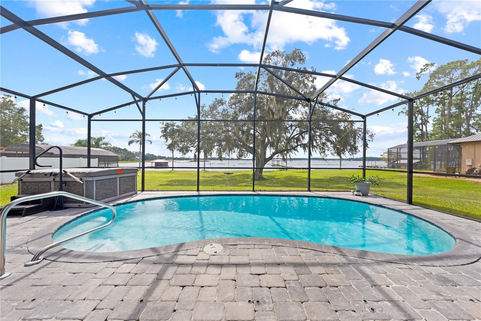 Chlorine heated pool and jacuzzi. Pool heater is electric - 590 EDEN DR, ST CLOUD