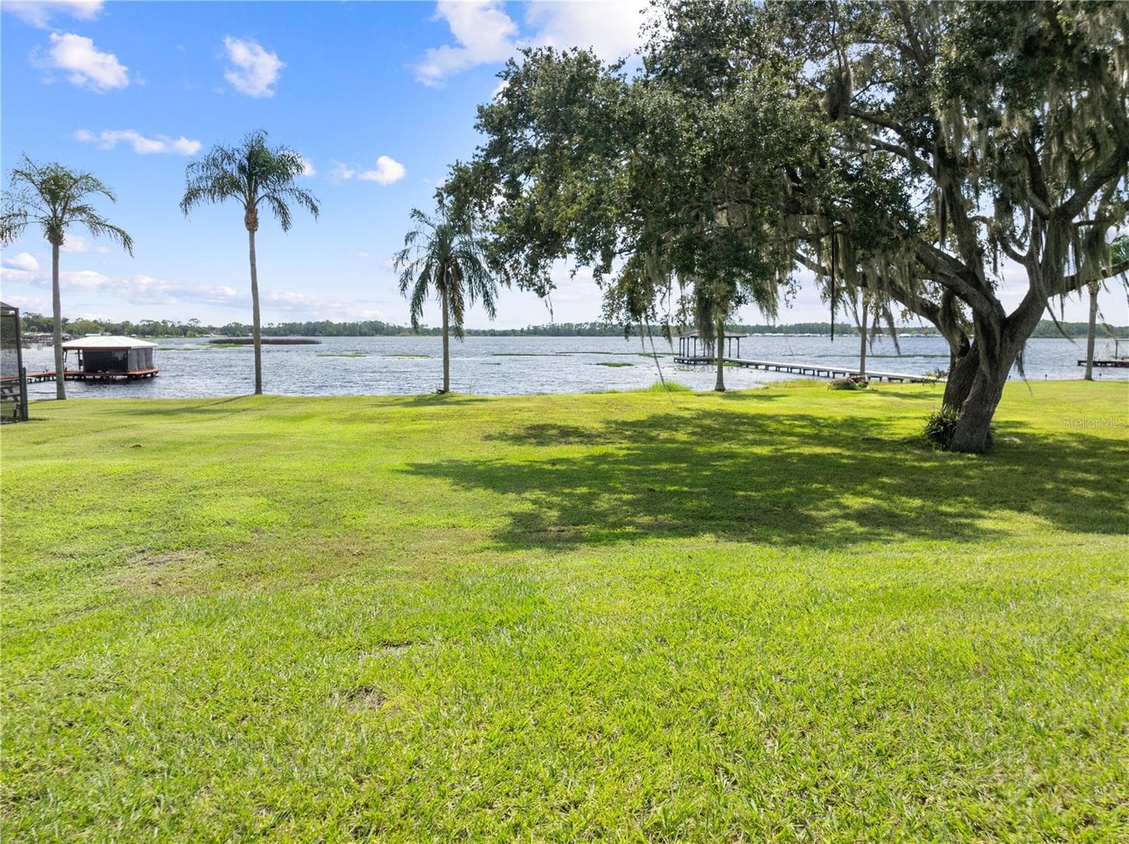 Spacious backyard overlooking Lake Center - 590 EDEN DR, ST CLOUD