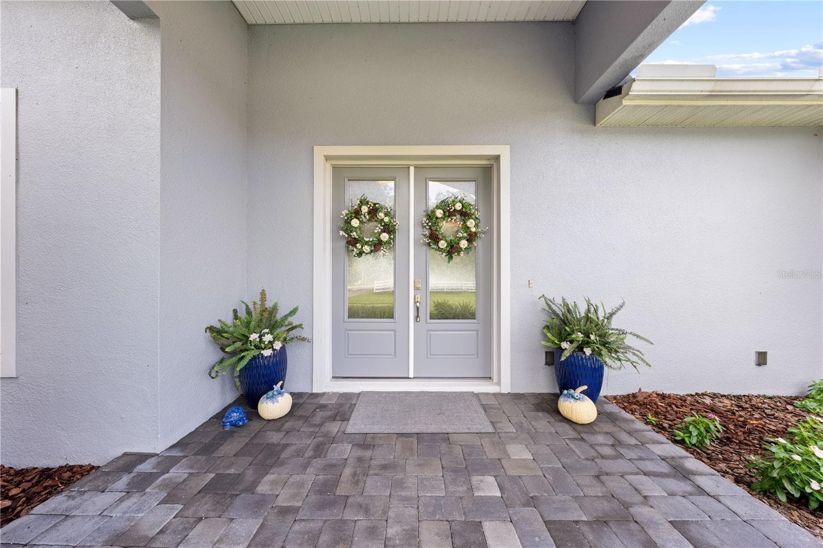 Double entrance doors and brick paver entrance. - 590 EDEN DR, ST CLOUD