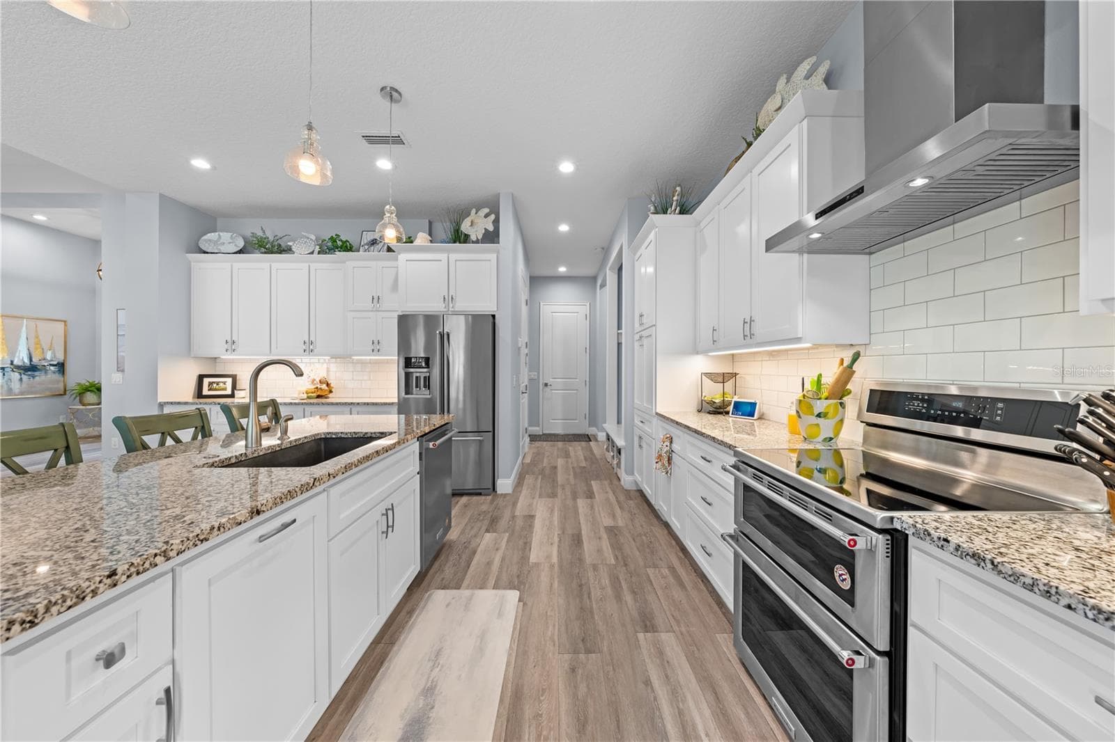 Kitchen with soft close drawers, double oven and granite countertops - 590 EDEN DR, ST CLOUD