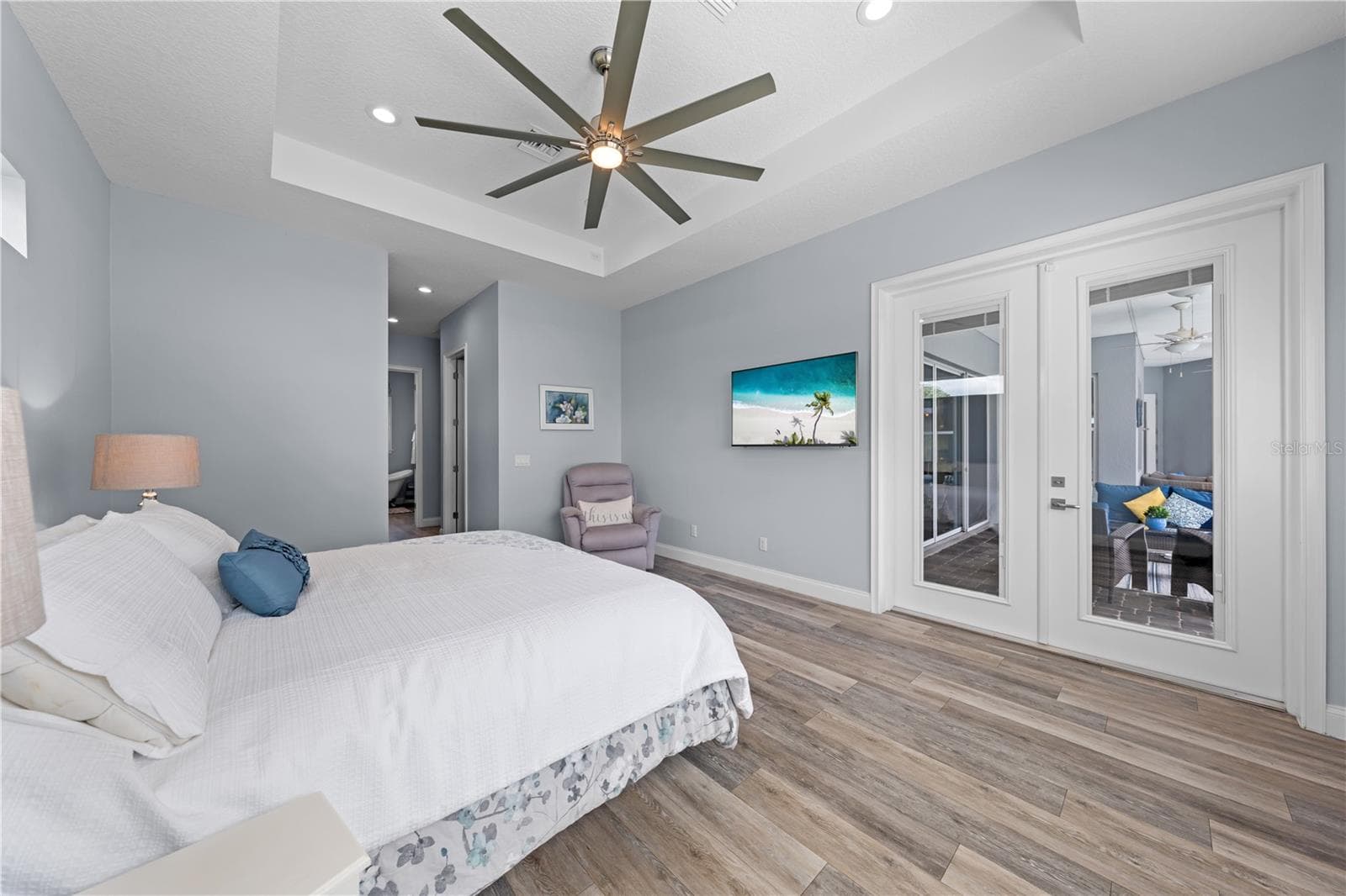 Primary Bedroom with double entry doors to the lanai - 590 EDEN DR, ST CLOUD