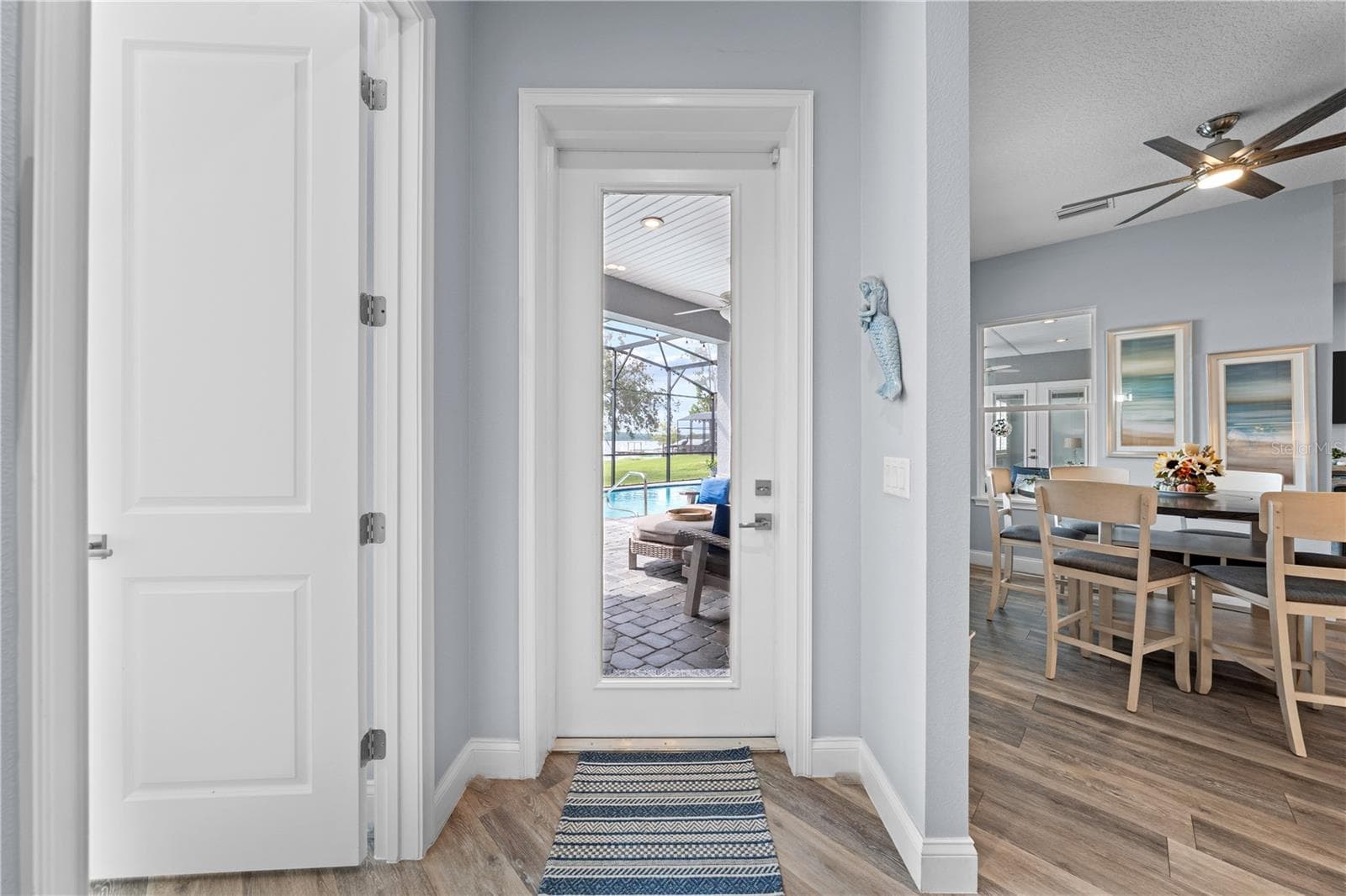 Door leading to the lanai from the 2nd primary bedroom area and just off the kitchen/dinette. - 590 EDEN DR, ST CLOUD