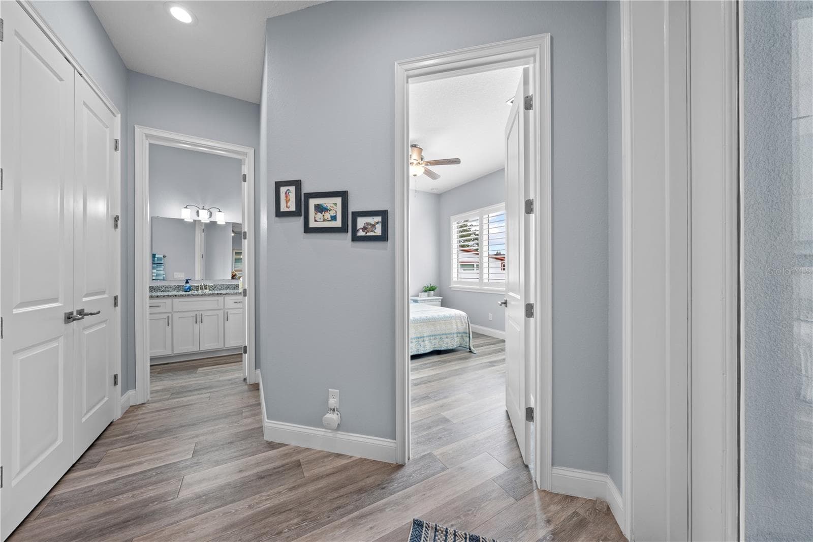 2nd primary hallway showing bathroom and 2nd primary entrance - 590 EDEN DR, ST CLOUD