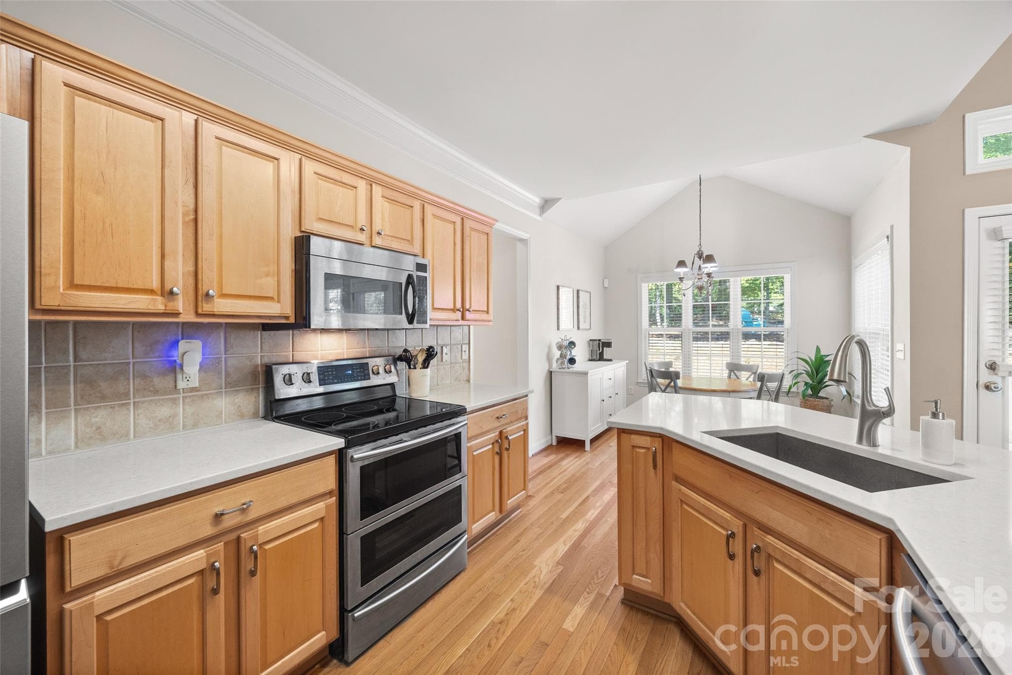 Kitchen with stainless appliances - 1718 Sanridge Wind Lane, Charlotte