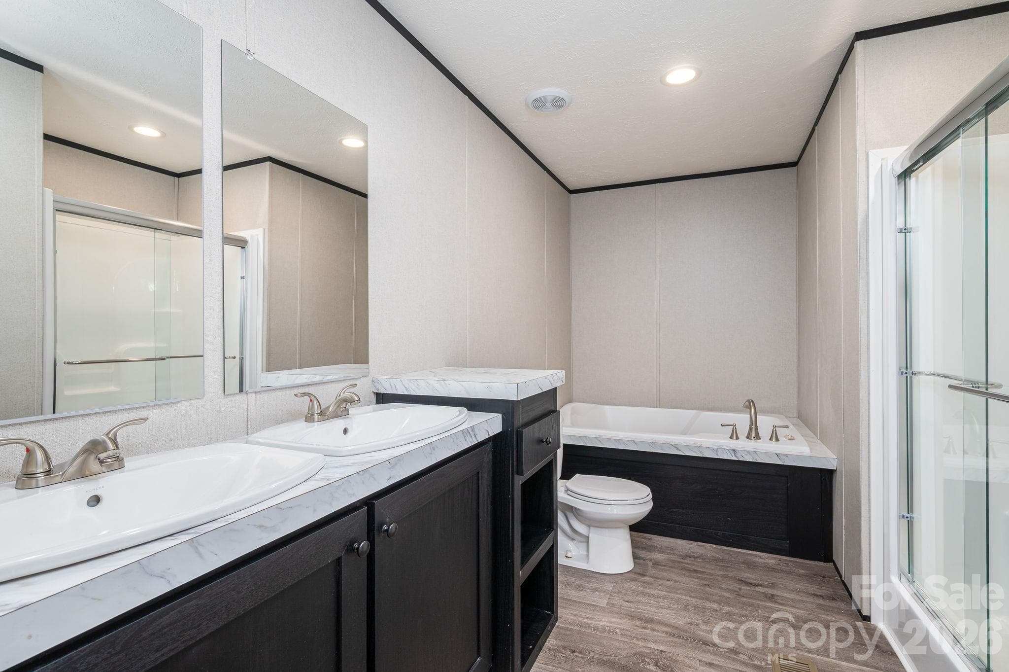 Primary Bath with double sink and extra cabinet space - 207 Grassy Field Court, Lawndale