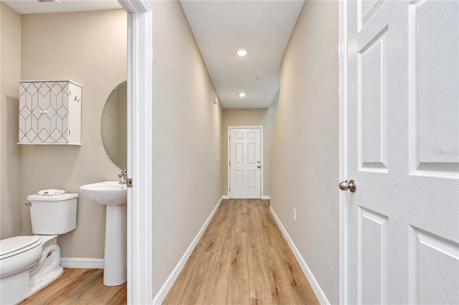 Main-level half bathroom for guests and everyday use. - 11484 BROOK EDGE AVE, RIVERVIEW