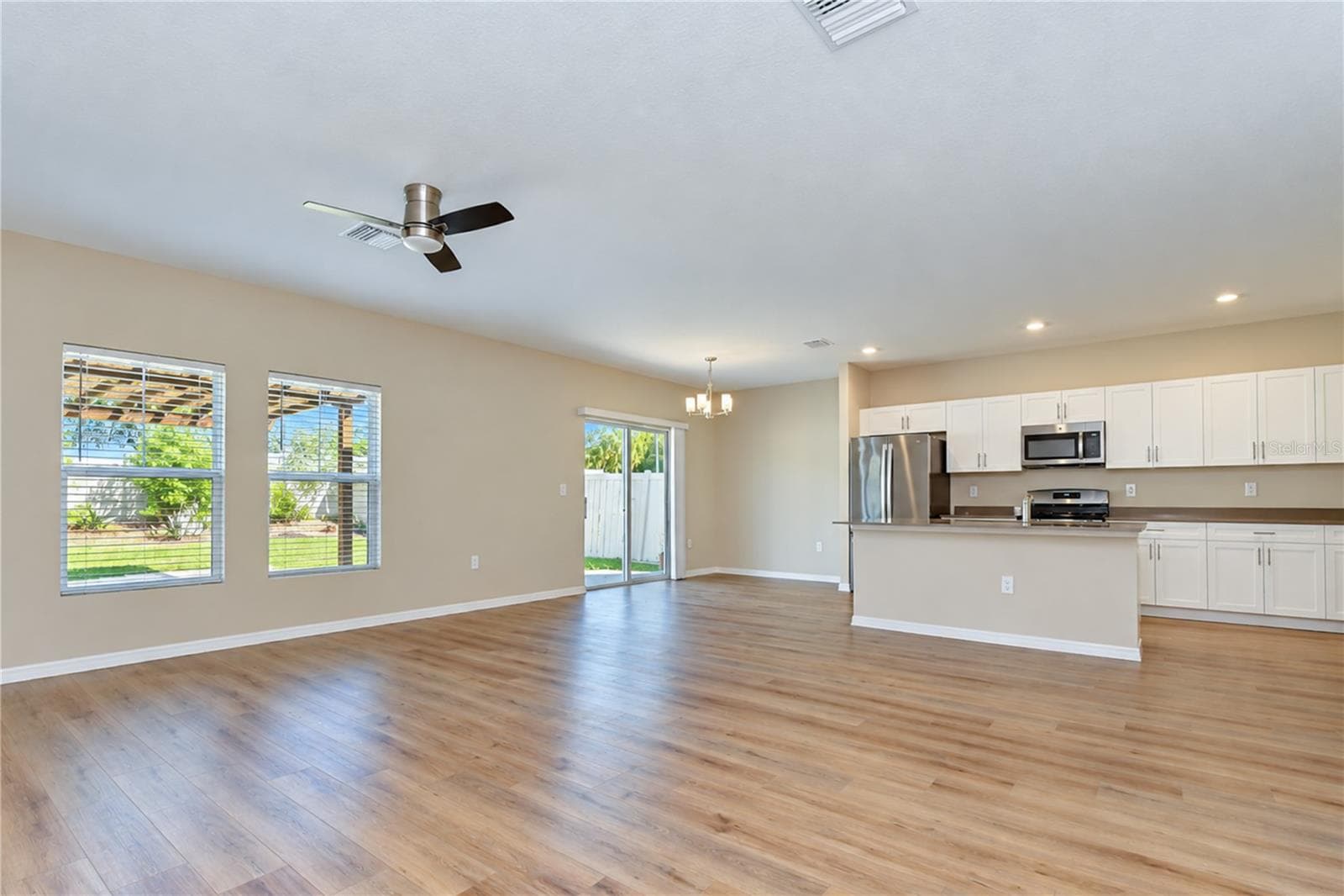Stylish flooring adds a modern touch throughout the living spaces. - 11484 BROOK EDGE AVE, RIVERVIEW