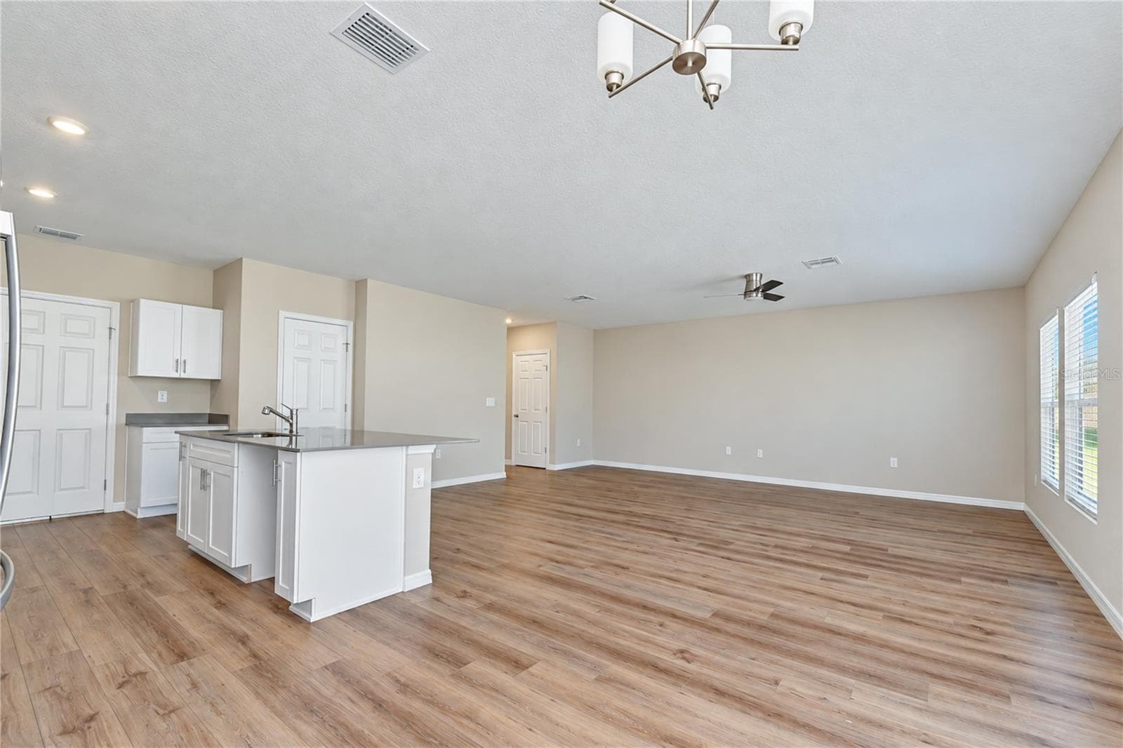 Open layout connects the kitchen with the great room and dining area. - 11484 BROOK EDGE AVE, RIVERVIEW