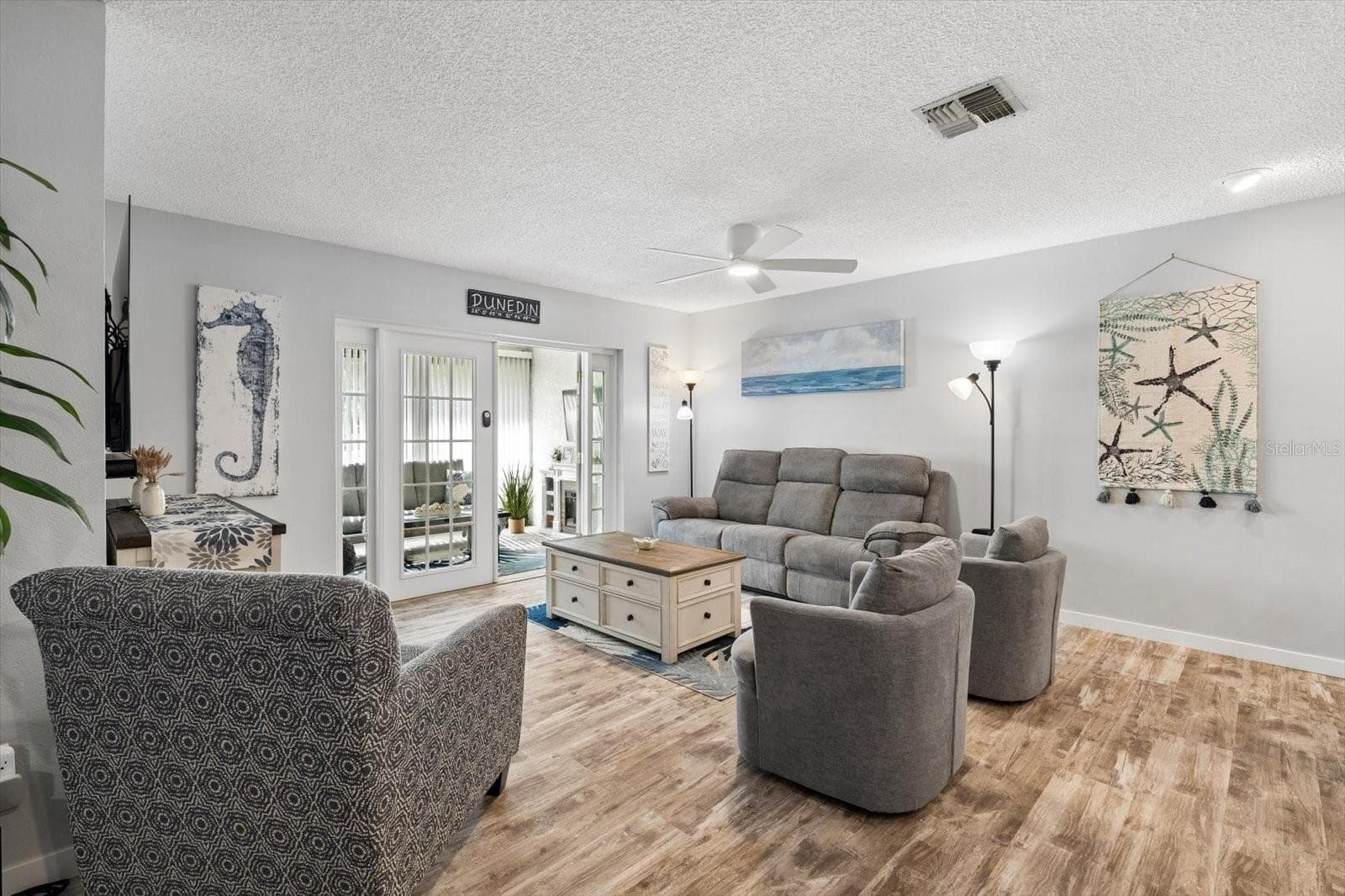 Living Room with french doors leading to enclosed lanai - 1307 STONEHAVEN LN, DUNEDIN