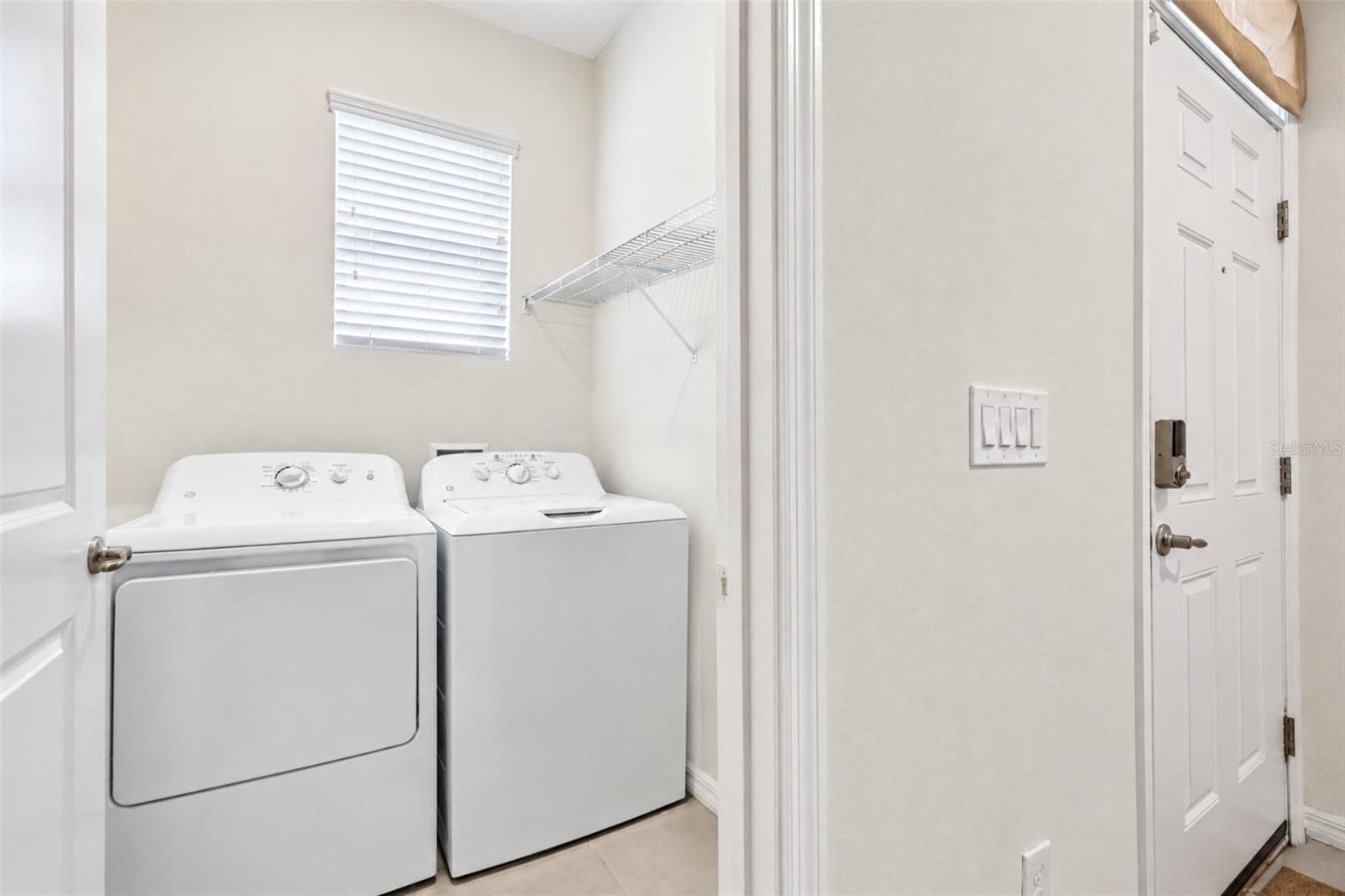 Laundry Room by front door - 5255 SUNSHINE DR, WILDWOOD