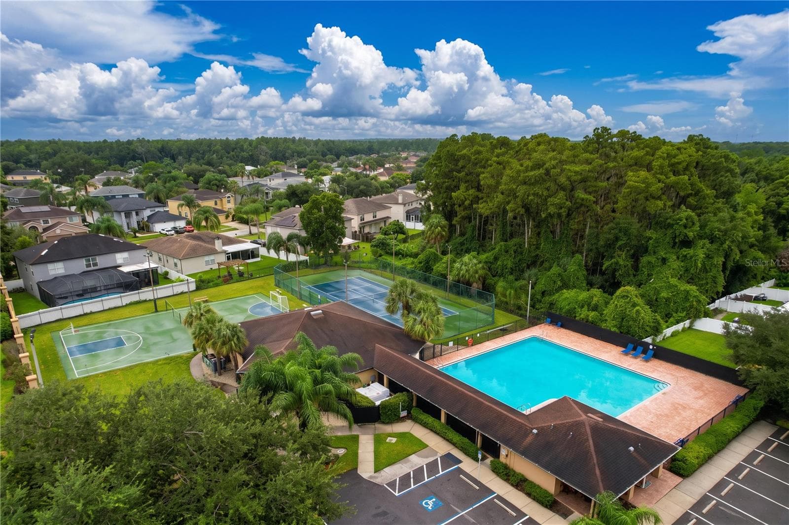 Club House with adjacent amenities - 27408 CORAL SPRINGS DR, WESLEY CHAPEL