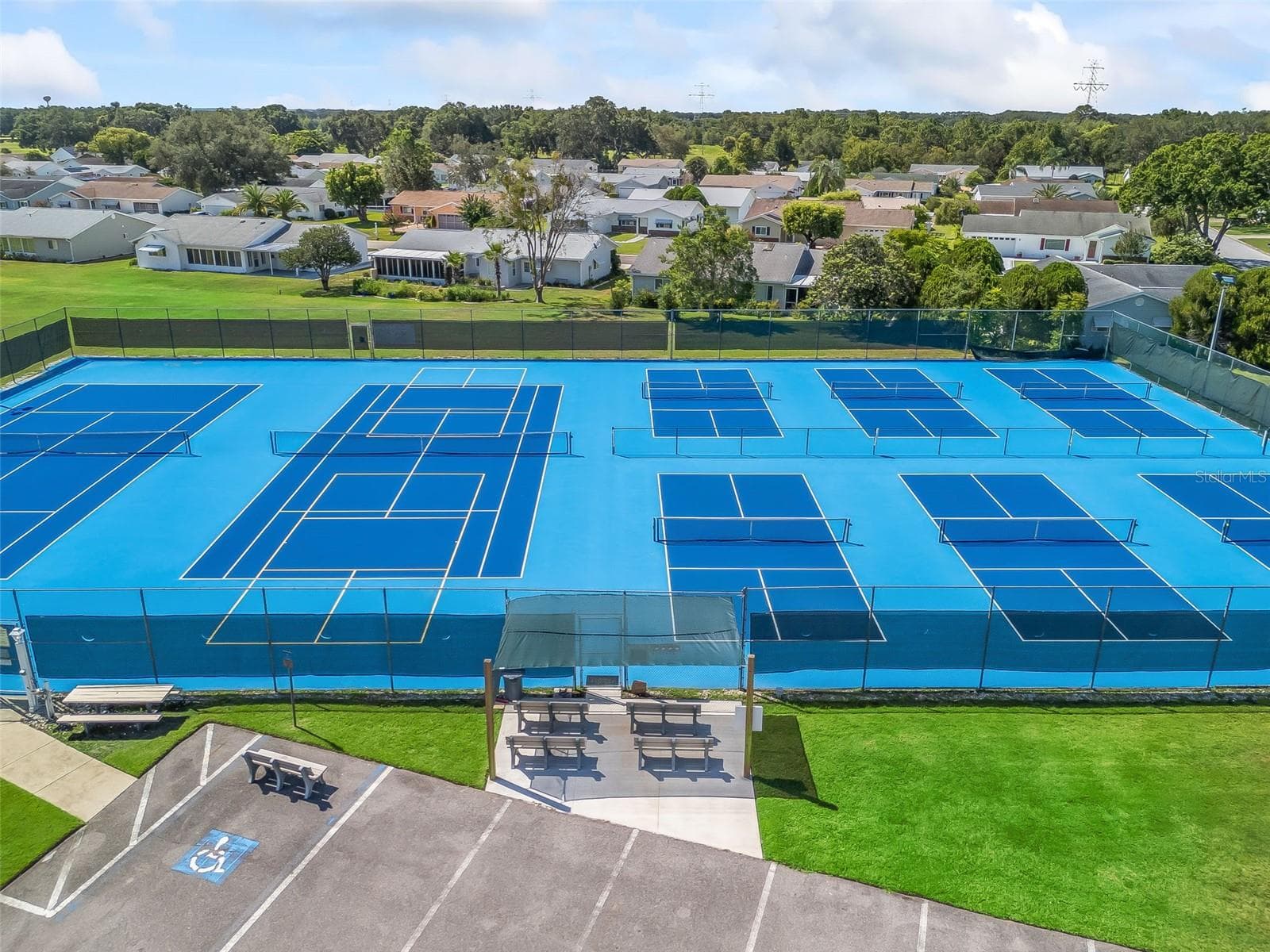 Spruce Creek South’s tennis and pickleball courts provide an inviting setting for recreation and friendly competition. - 17909 SE 99TH AVE, SUMMERFIELD