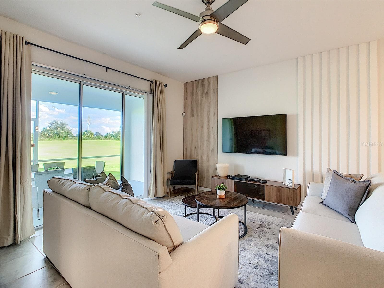 Living Room TV - 763 OCEAN COURSE AVE., CHAMPIONS GATE