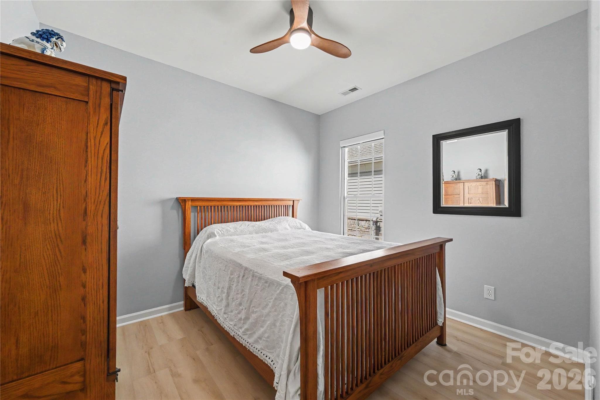 Third Bedroom features ceiling fan, neutral paint, LVP Flooring, and ample closet space. - 3054 Azalea Drive, Indian Land