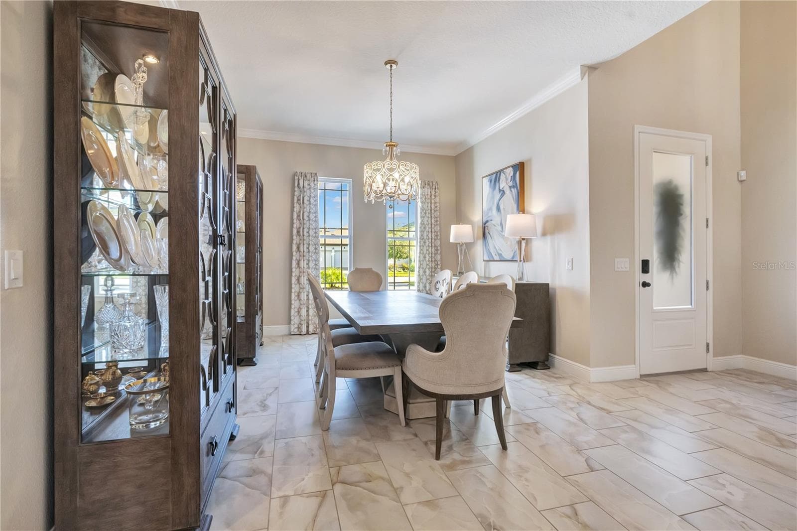 Spacious dining area with natural light and convenient access to the adjoining kitchen. - 17600 LAKE STAR RD, WINTER GARDEN