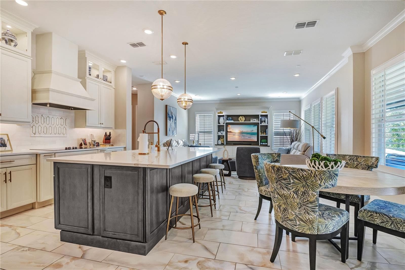 Open kitchen layout connects the island, breakfast nook and family room for everyday living and entertaining. - 17600 LAKE STAR RD, WINTER GARDEN