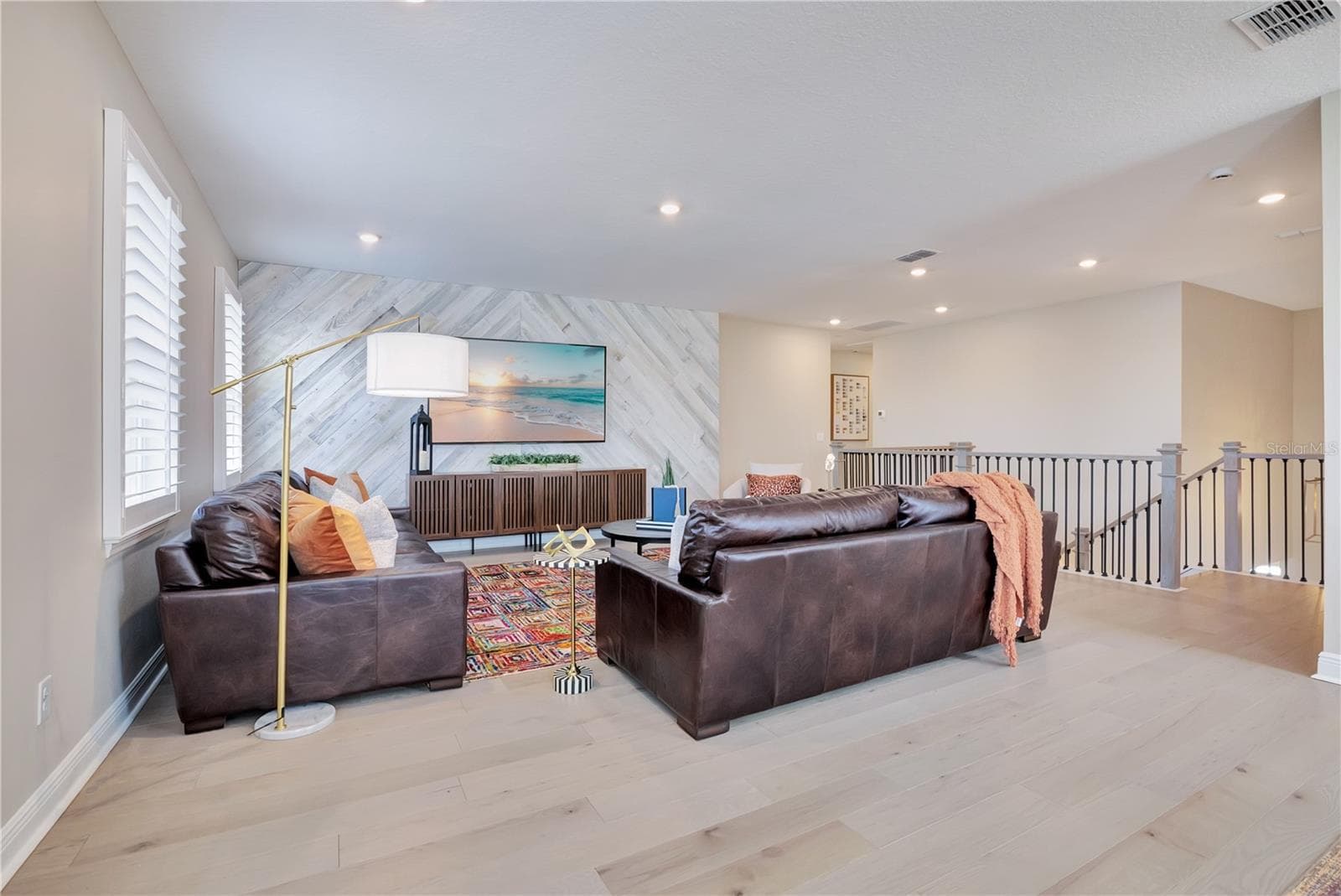Upstairs gathering space offers generous room for comfortable seating and movie nights. - 17600 LAKE STAR RD, WINTER GARDEN
