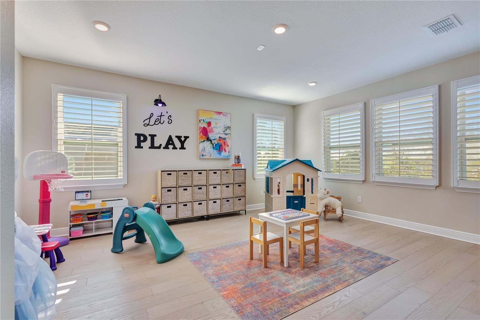 Bright play area within the upstairs loft offers flexible space for recreation, hobbies or study. - 17600 LAKE STAR RD, WINTER GARDEN
