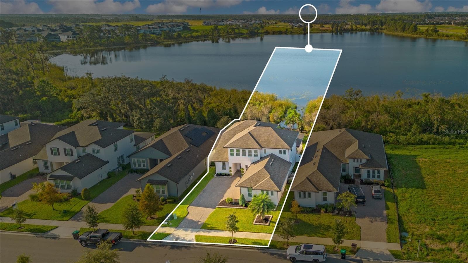 Aerial view highlights the home’s setting beside the lake. Outline is approximate and for illustration only. - 17600 LAKE STAR RD, WINTER GARDEN