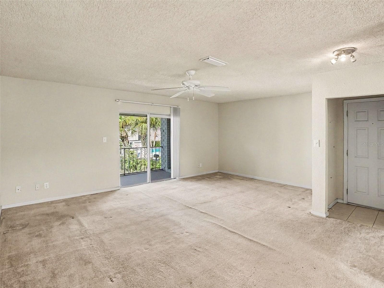 Living Room Access to Balcony w/Storage Closet - 216 LEWFIELD CIR #216, WINTER PARK