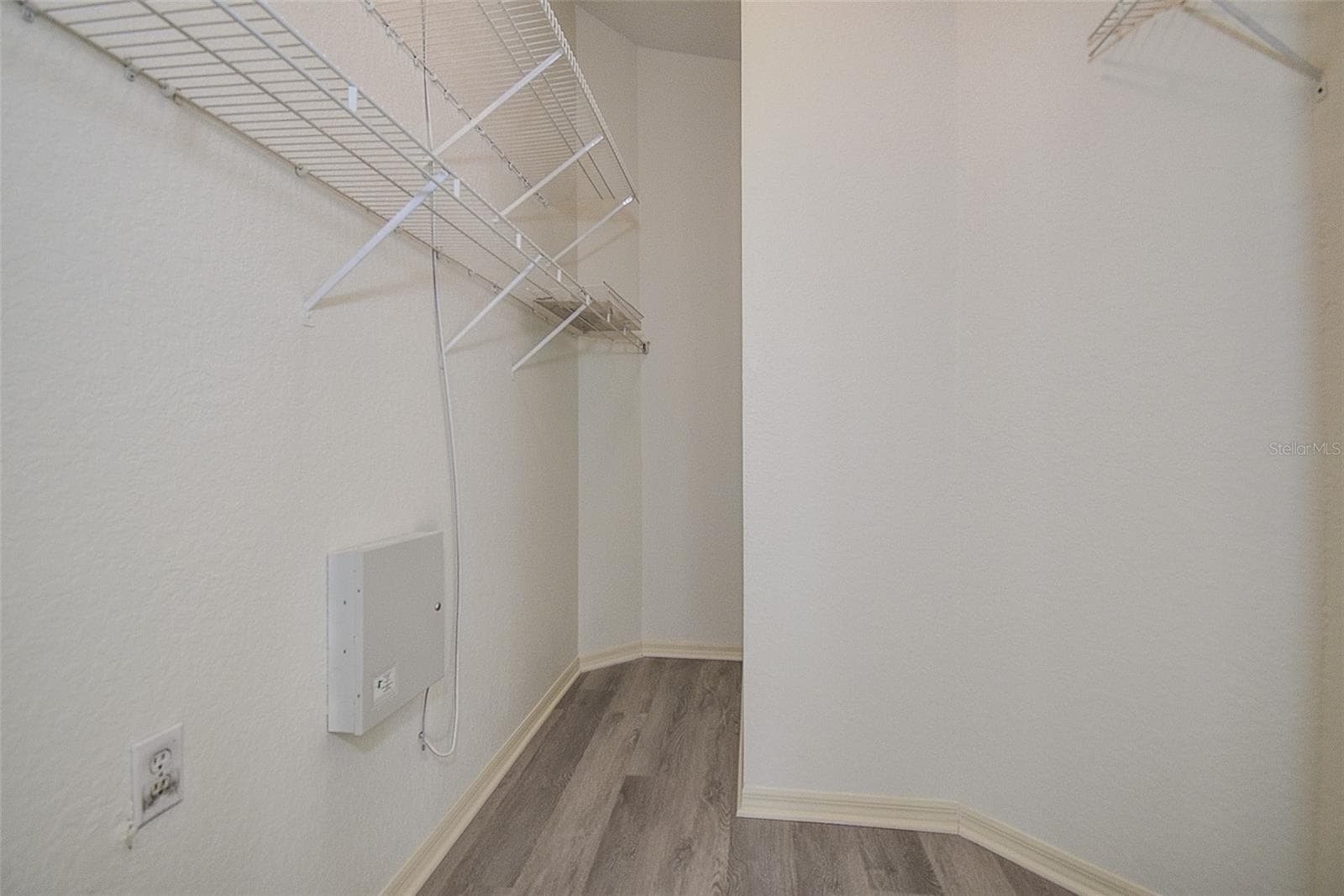 Walk-in Closet at Primary bedroom - 28935 STORMCLOUD PASS, WESLEY CHAPEL