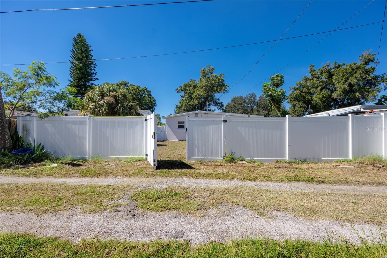 Backyard with T-Gate for alley access - 1714 55TH ST S, GULFPORT
