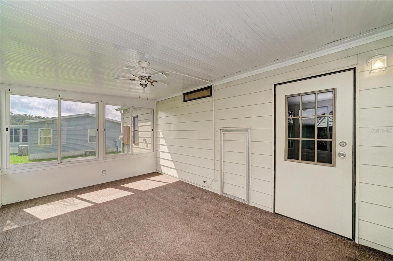 Alternate view of sunroom. Water heater is behind the small opening door. Plenty of opportunity to make it the way youd like. - 42 MEADOWLARK CIR, ELLENTON