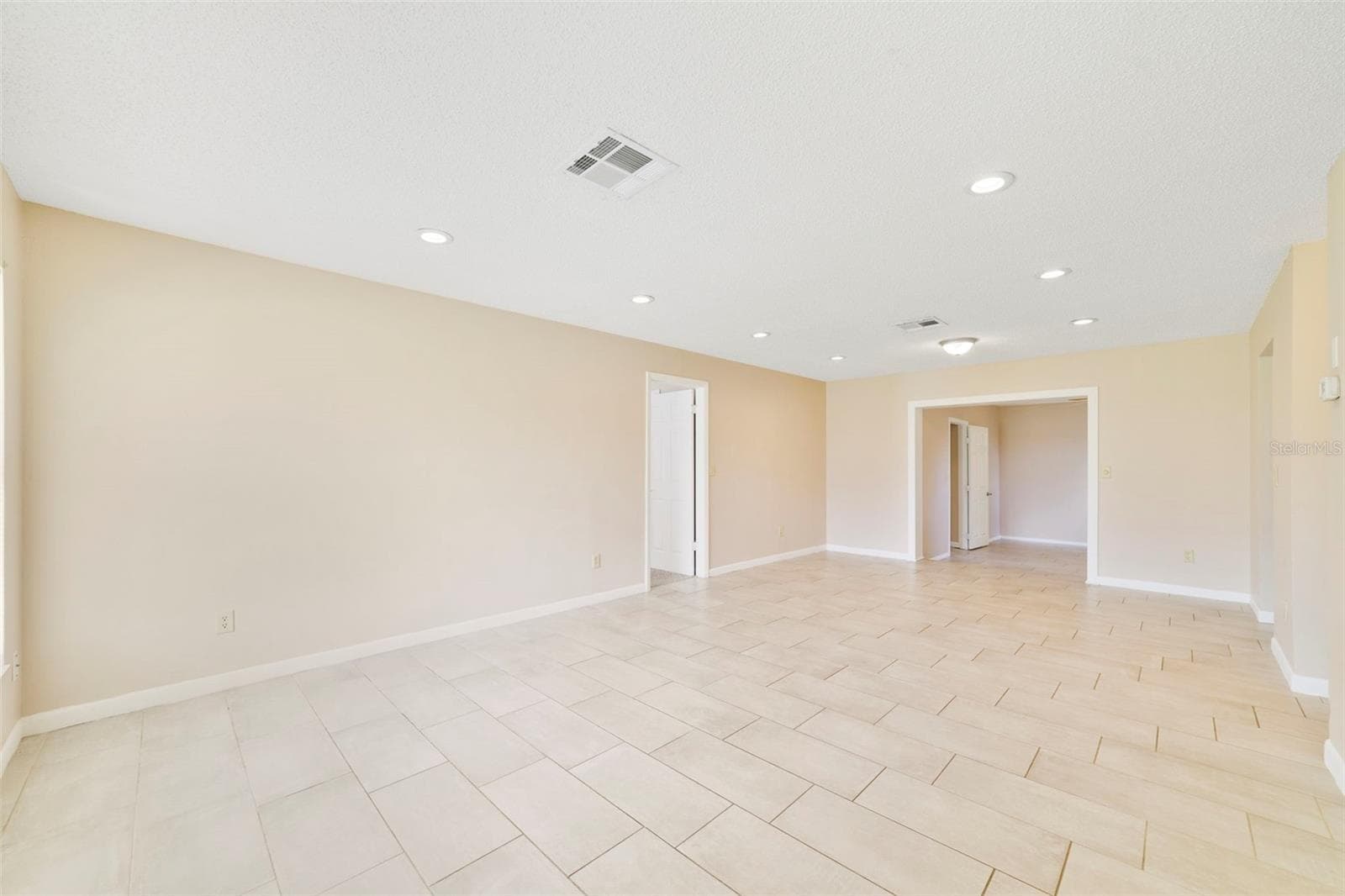 Living Room / Dining Room and Bonus Room - 2638 BEAL ST, DELTONA