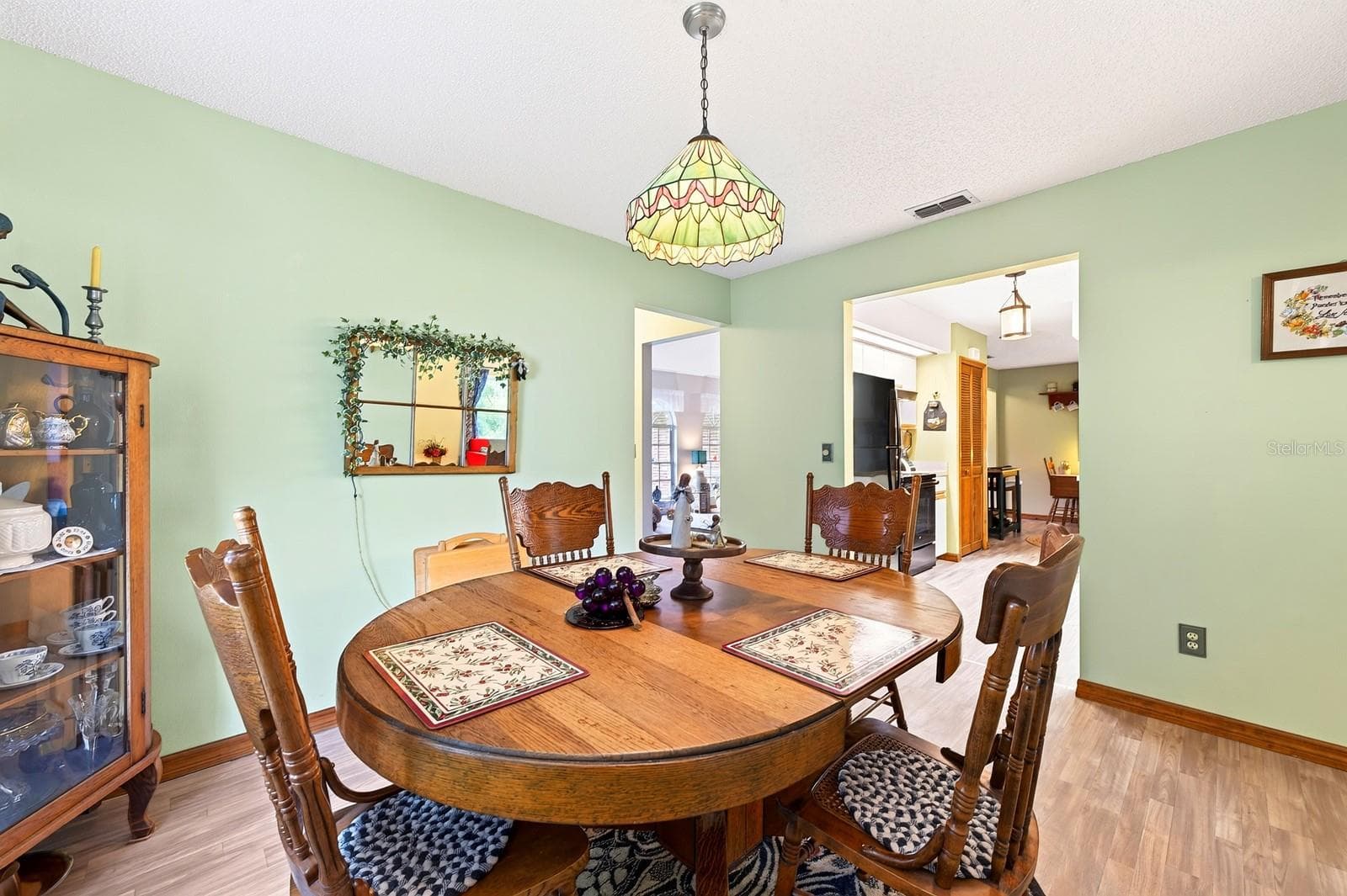 A FORMAL DINING ROOM provides a dedicated space for hosting dinners and special occasions. - 2163 NEWMARK DR, DELTONA