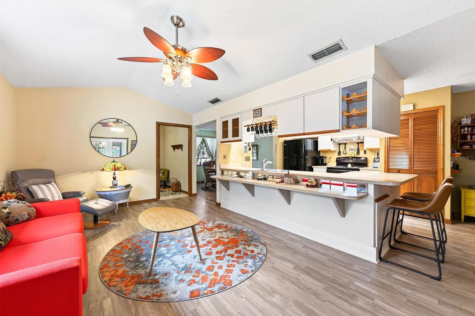 Overlooking the Family Room, the Kitchen keeps everyone connected. - 2163 NEWMARK DR, DELTONA